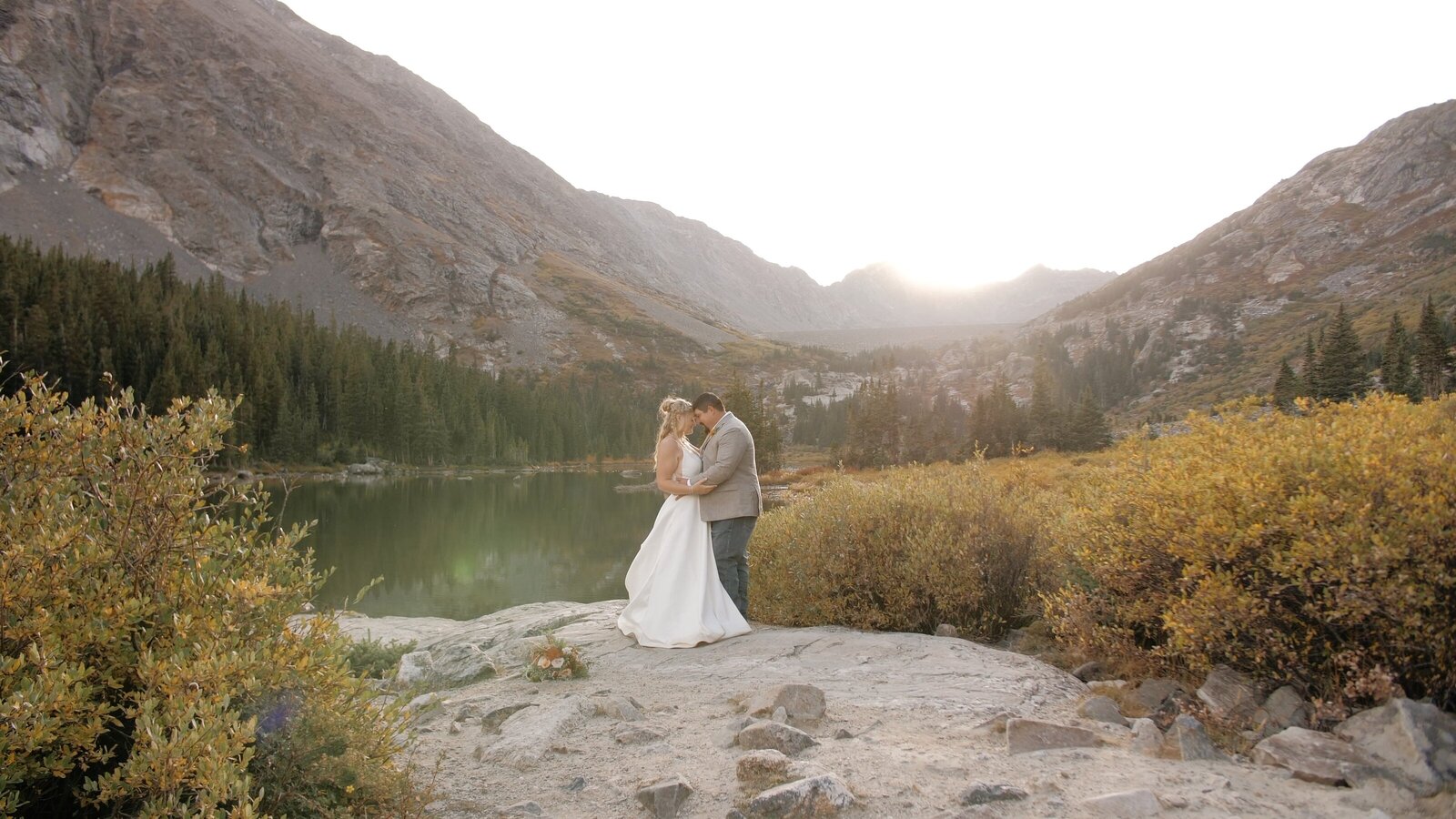 Bride and groom elope together on a mountain in Colorado