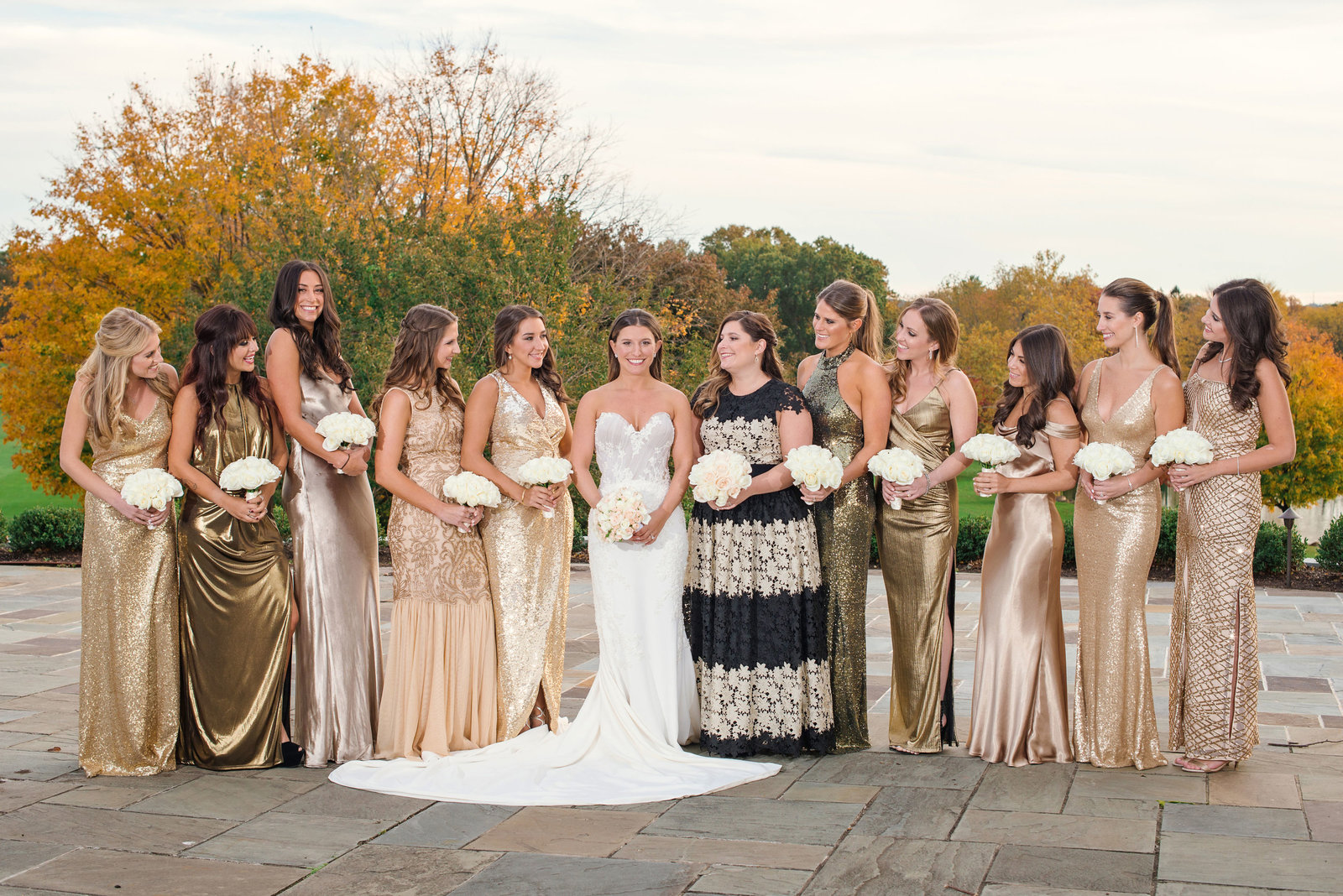 bride and her bridesmaids laughing at Glen Head Country Club