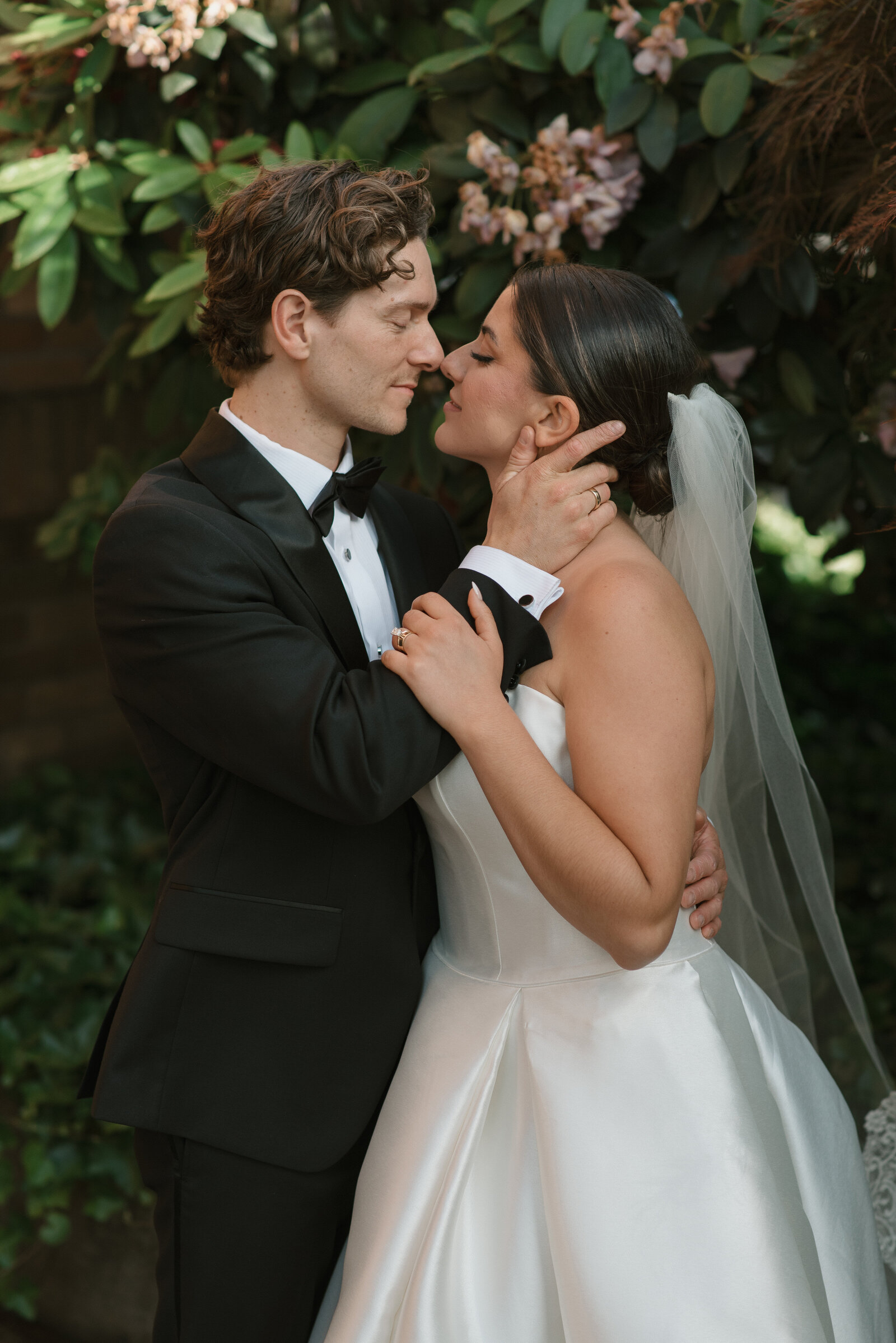 romantic snuggling photo of a bride and groom