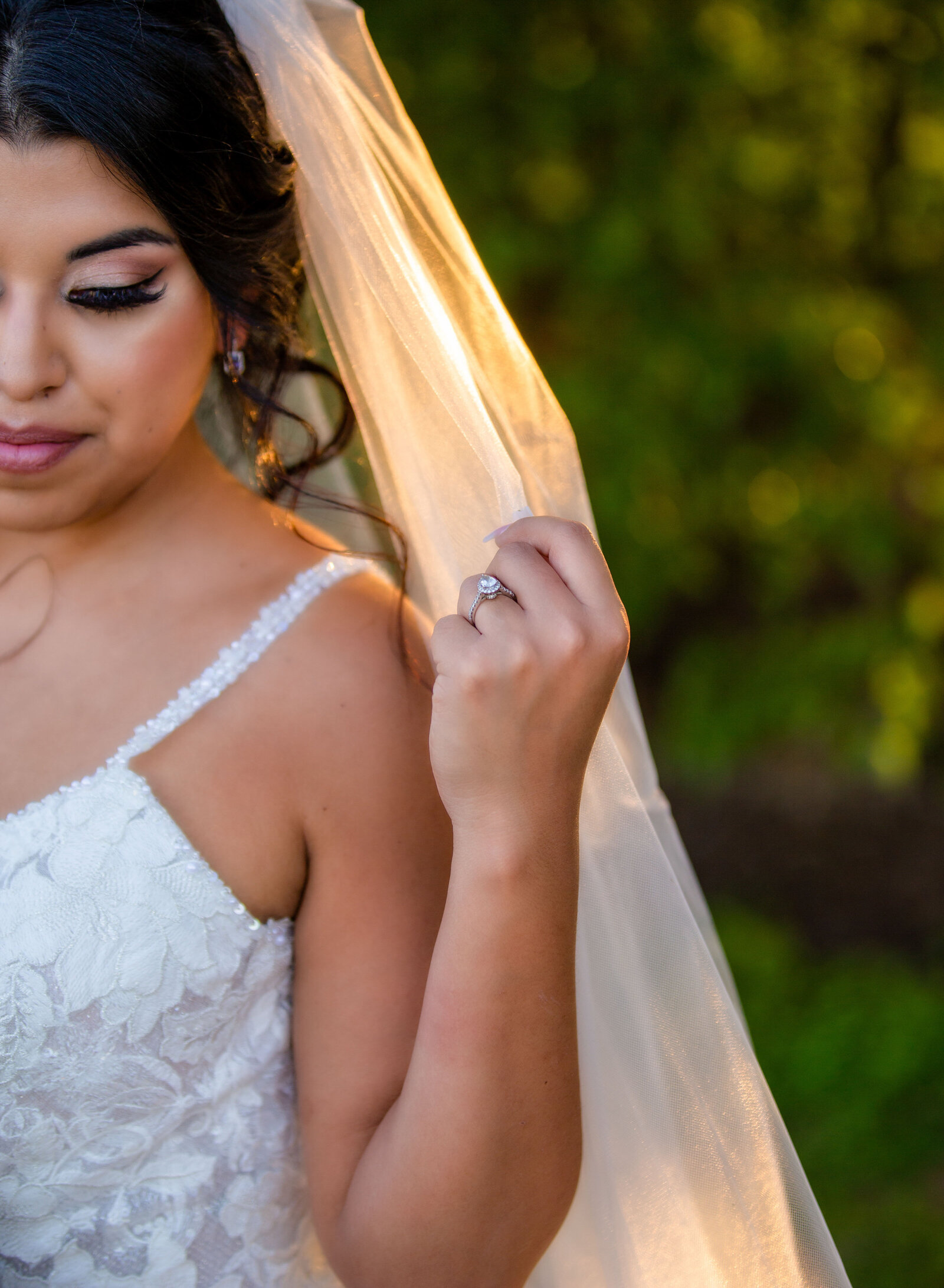 closeup of bride's ring and veil