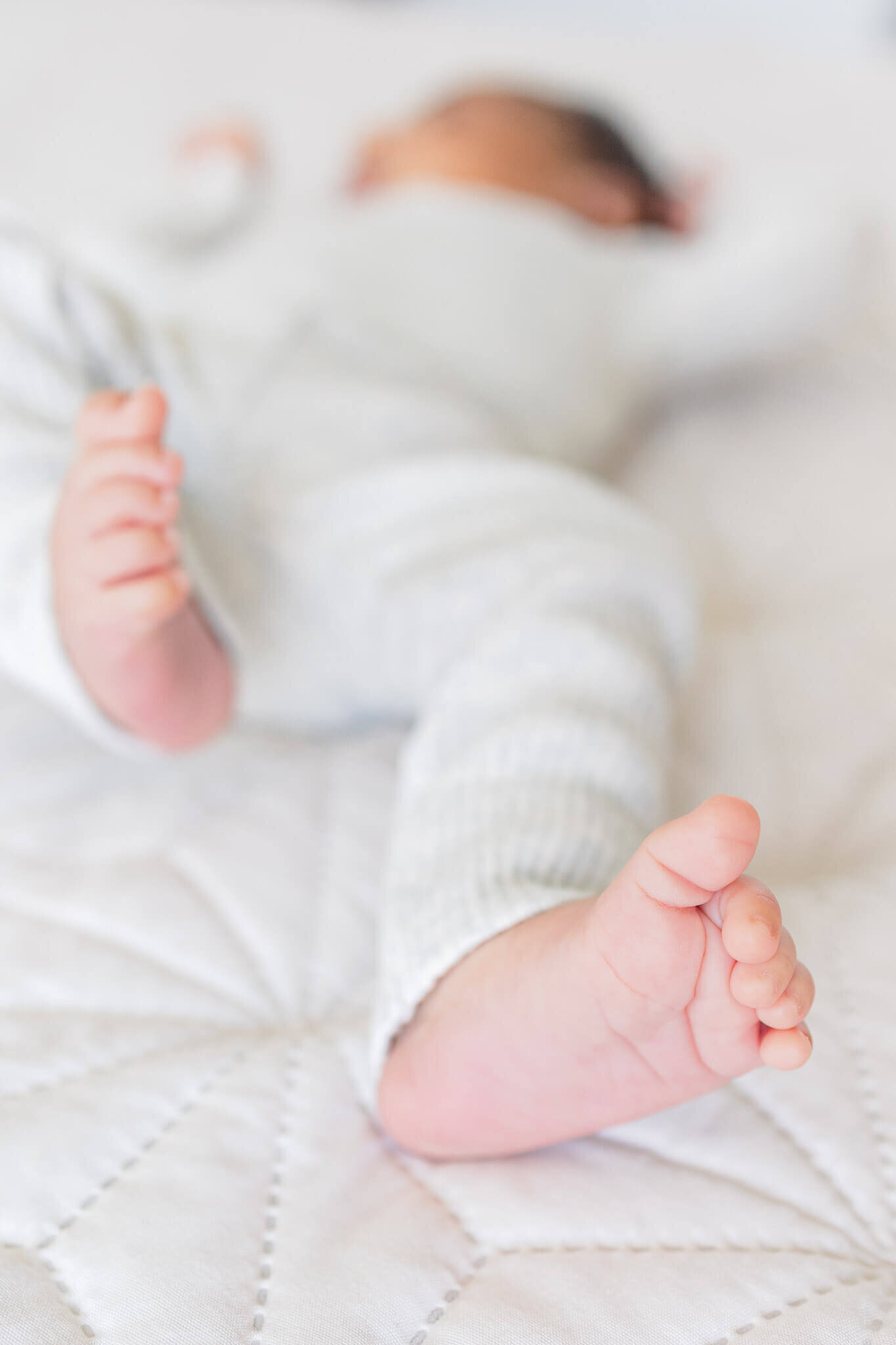 A close-up of a newborn boy's feet.
