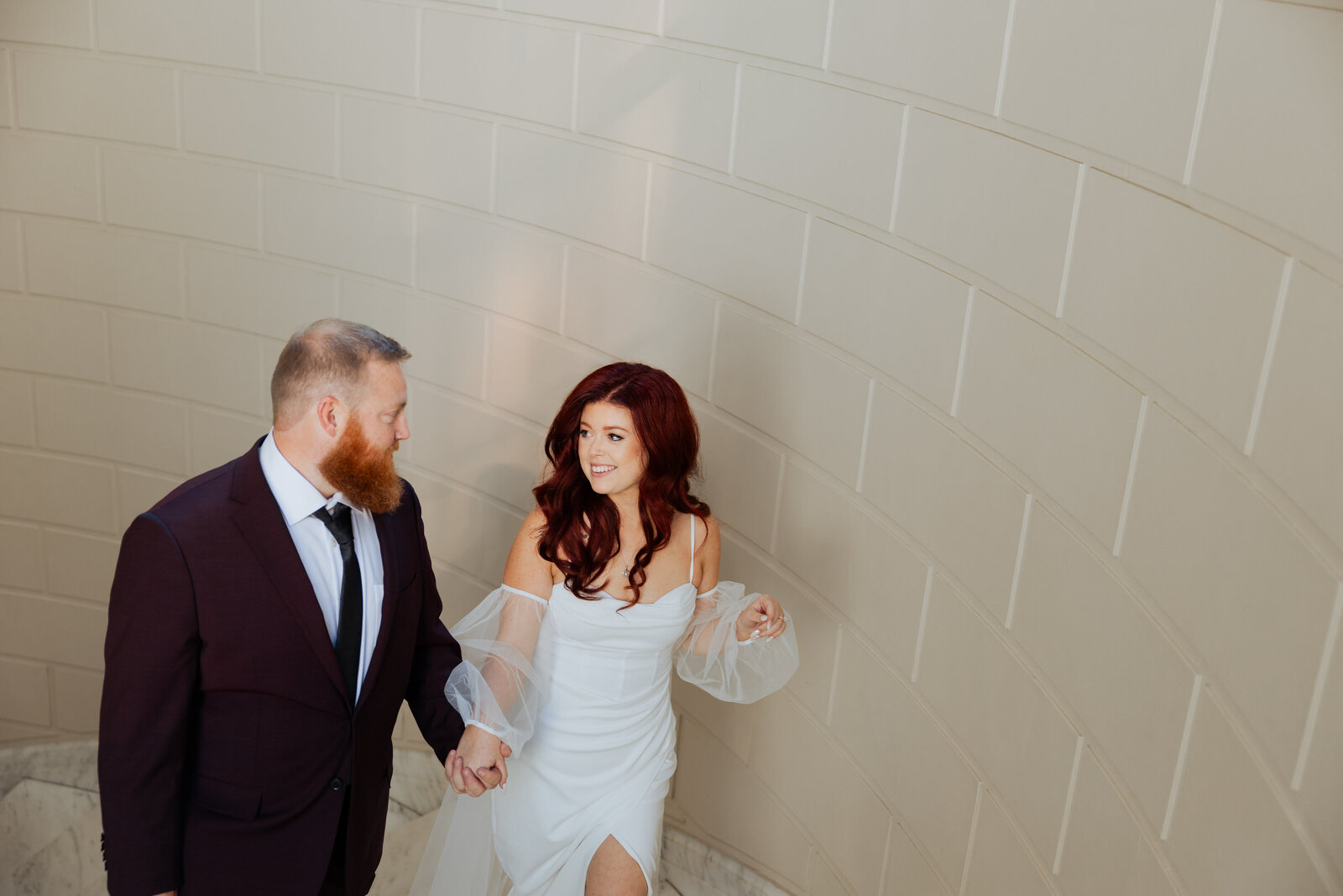 Portland City Hall is a stunning historic building with grand staircases, elegant columns, and classic architectural details—making it a perfect backdrop for timeless wedding portraits.