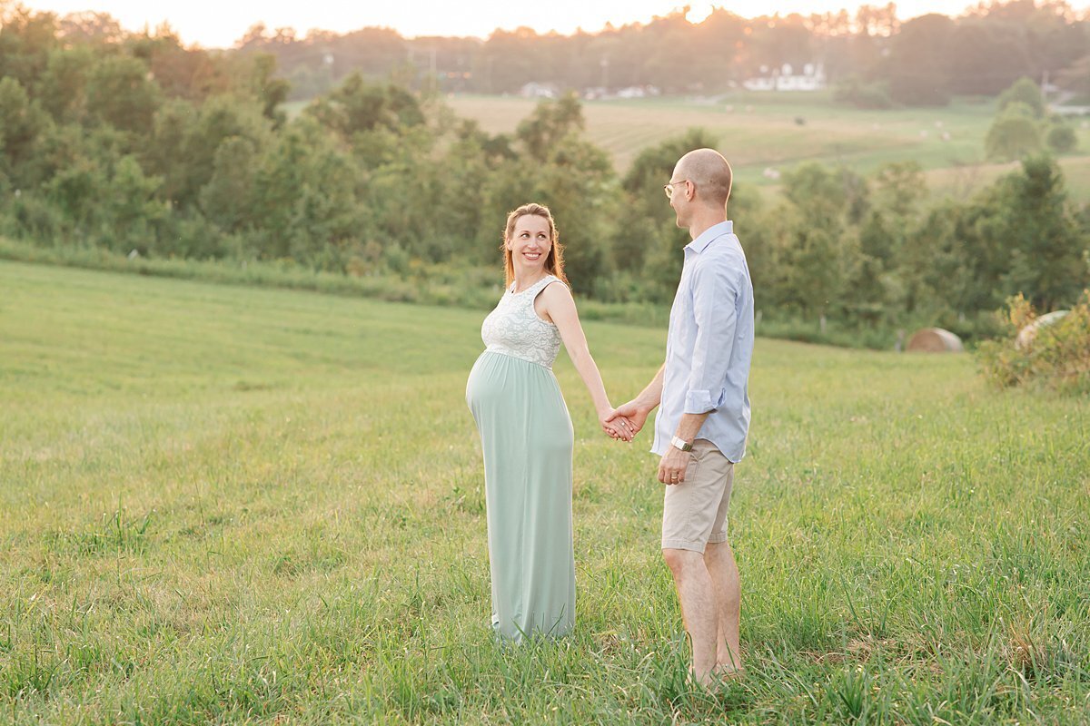 Sunset outdoor photo of pregnant couple for their Maryland Maternity Photography session