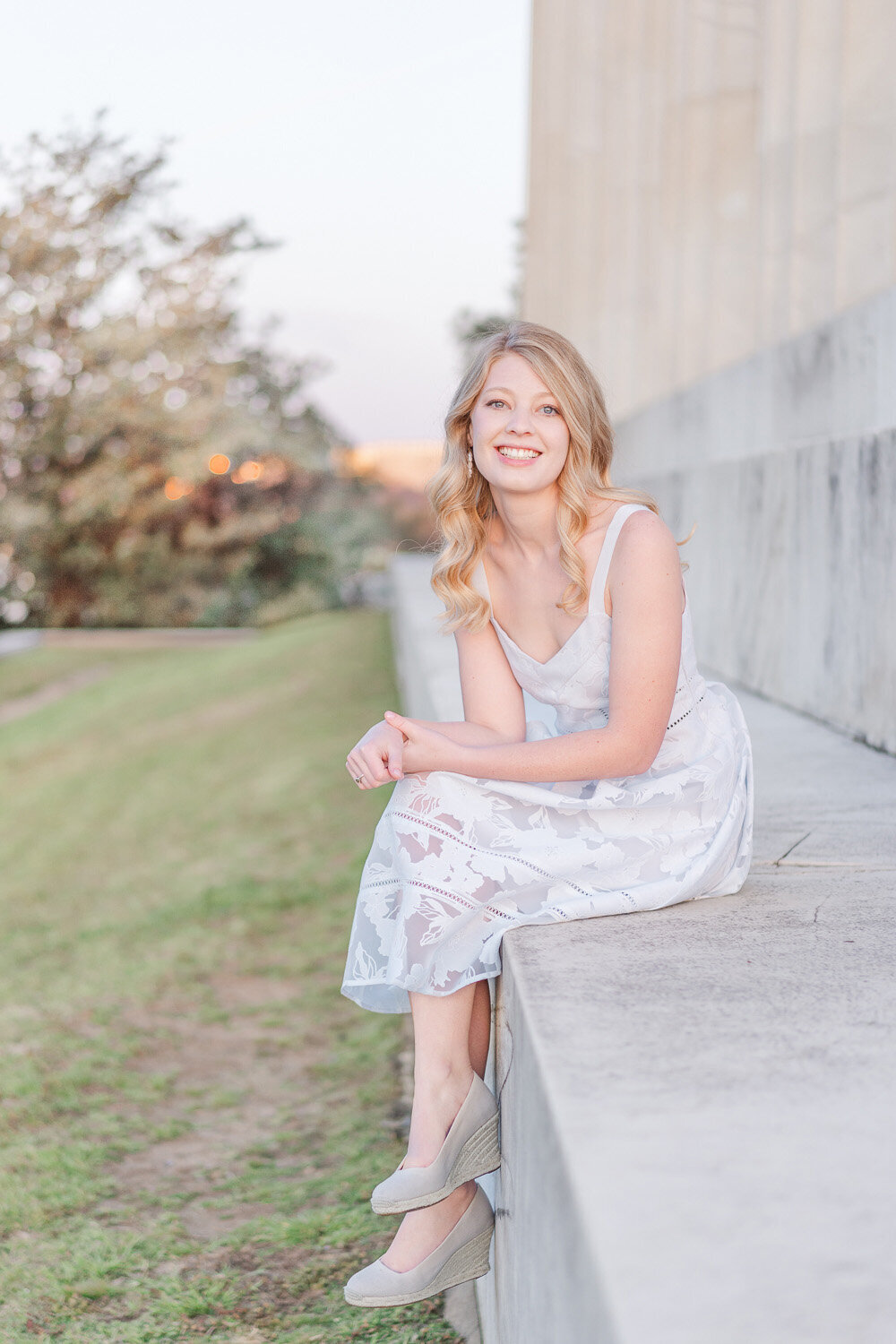 girl sitting on the  steps of Lincoln Memorial