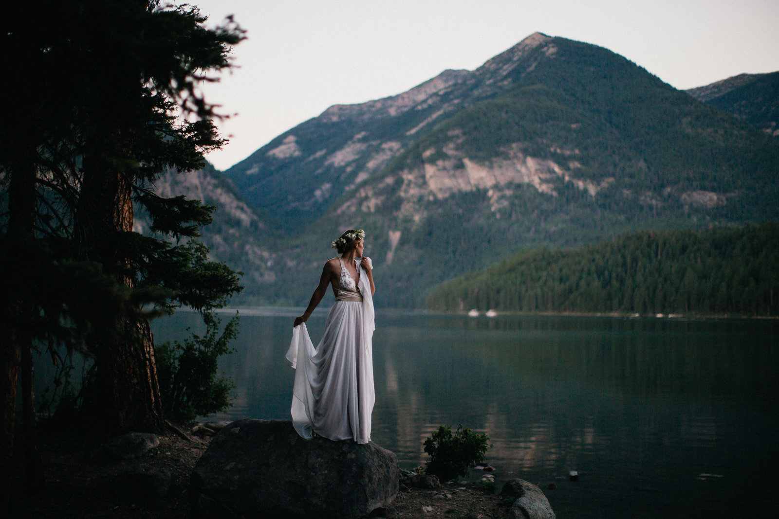 Dramatic shot of the bride overlooking Holland Lake near Kalispel. Montana