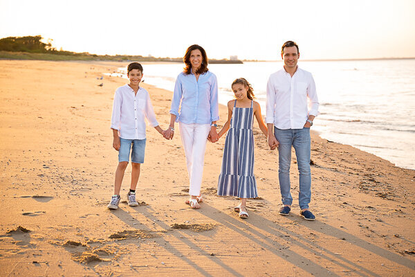 East Brunswick NJ Family Photographer Bayshore Waterfront Park Sunset Family of 4 walking down beach