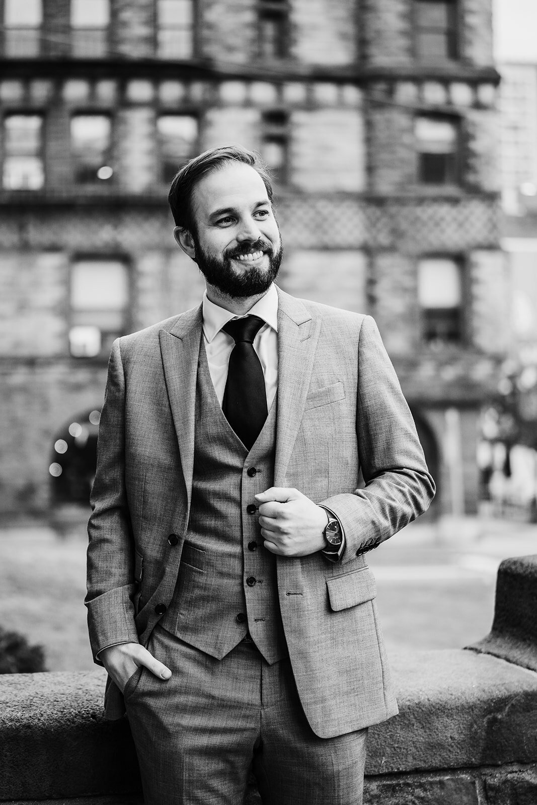 black and white portrait of a groom in downtown boston for city hall elopement