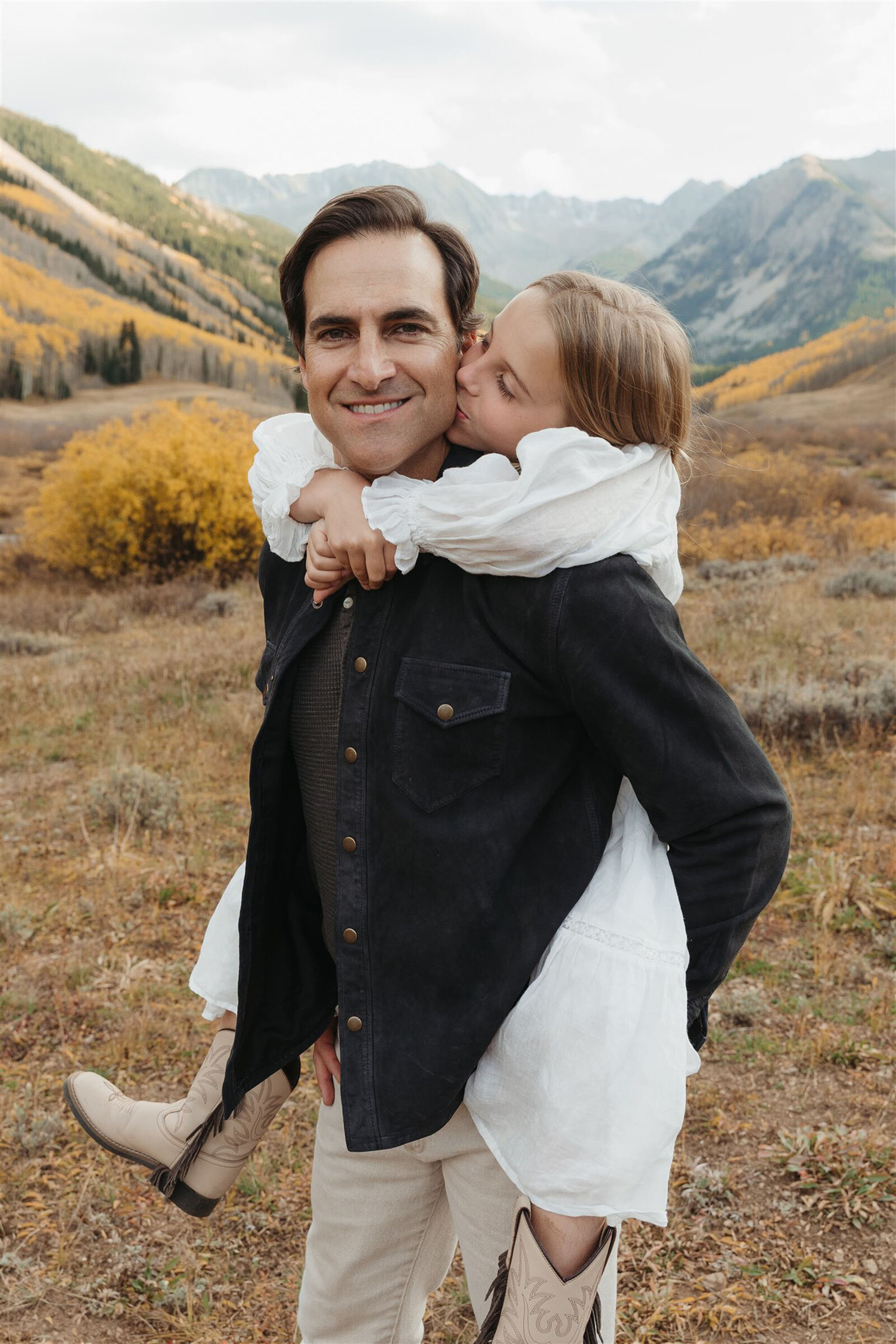 Editorial Aspen family photography — stylish family walking together in classic Ralph Lauren–inspired outfits.