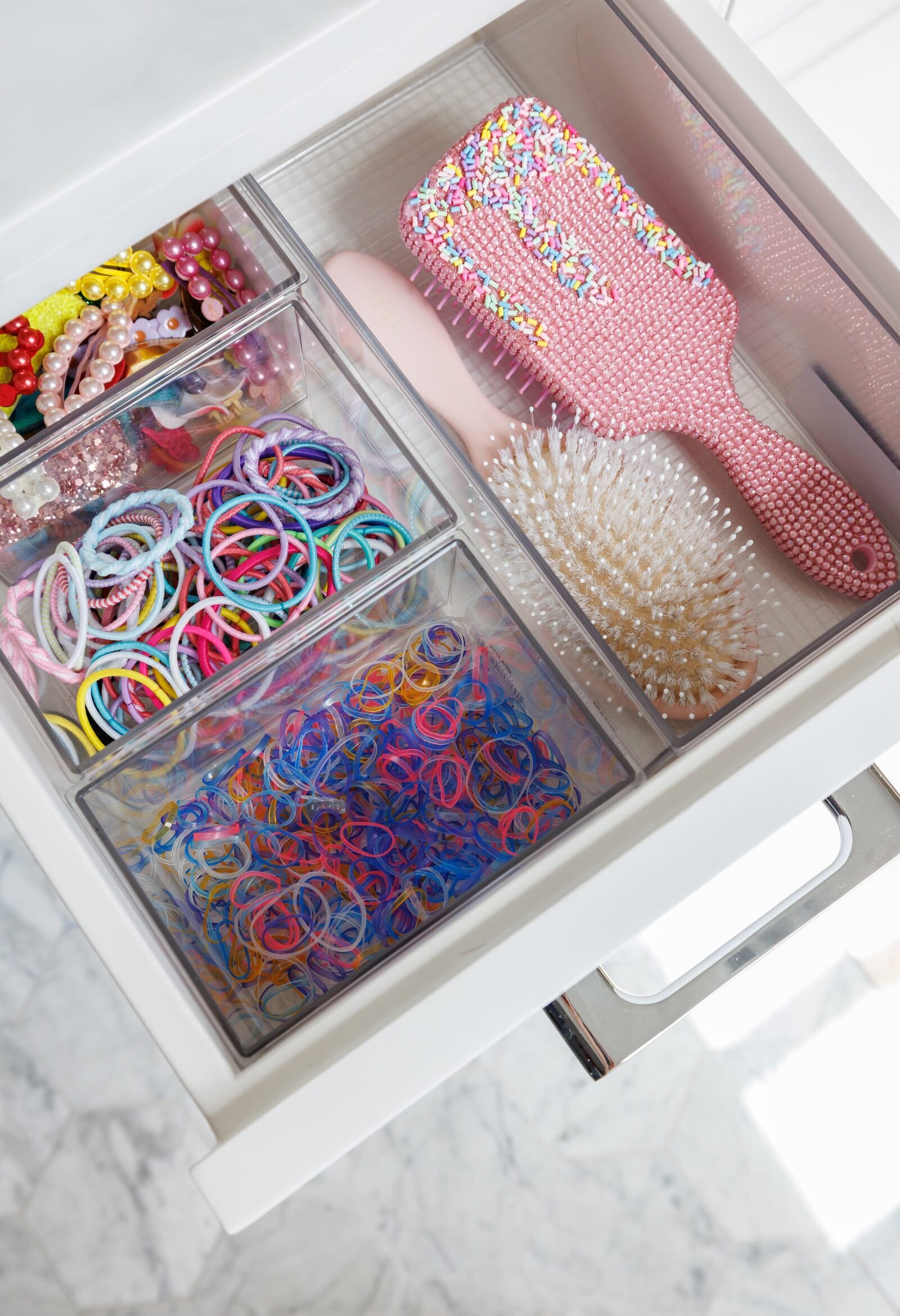 vision and hammer organization of girls hair bands and comb in drawer