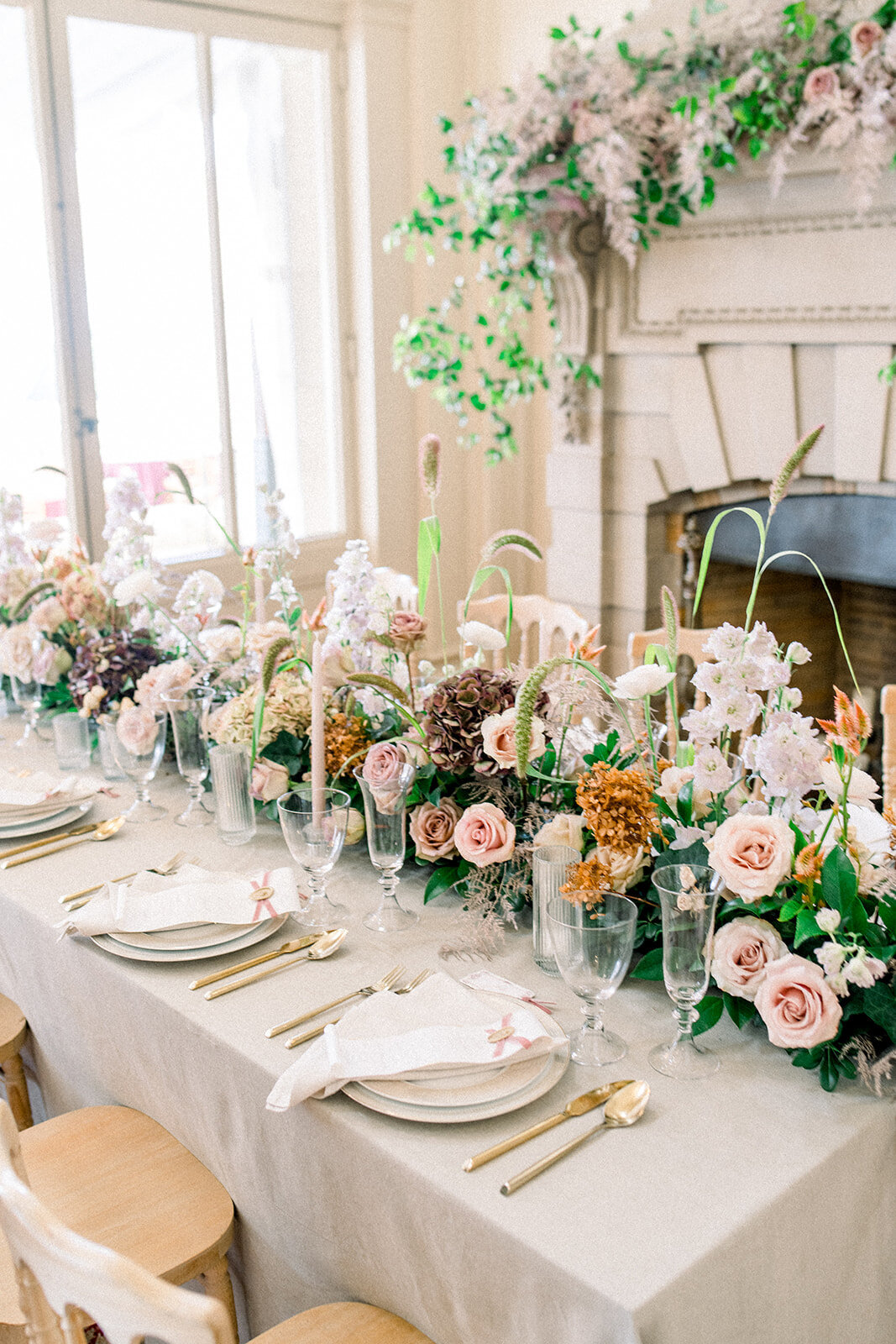 A beautifully decorated reception table at the Filoli wedding, showcasing elegant floral arrangements and luxurious table settings.