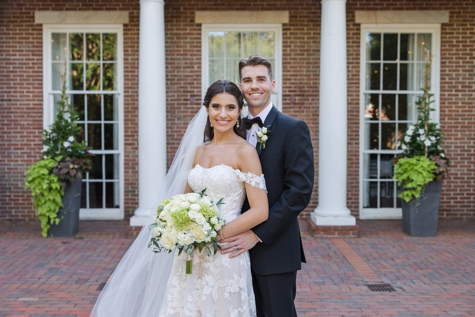 Tidewater Inn wedding in Easton Maryland photo of couple in courtyard by Christa Rae Photography