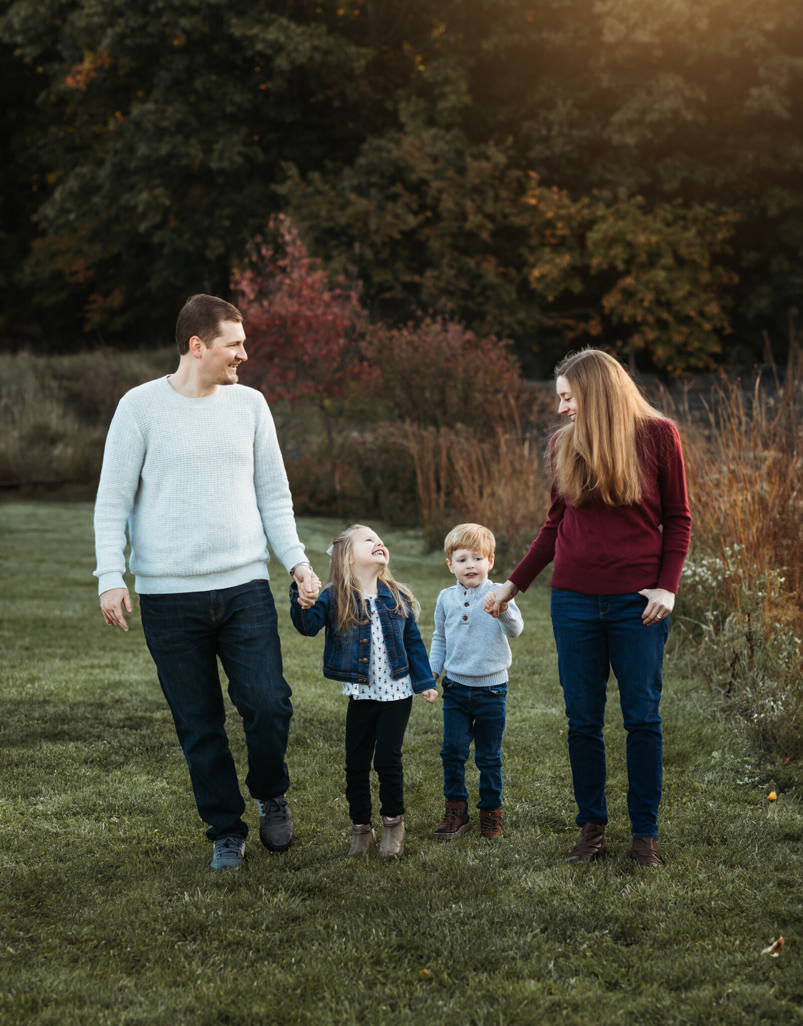 mom and dad walking with son and daughter for family photos cleveland family photography