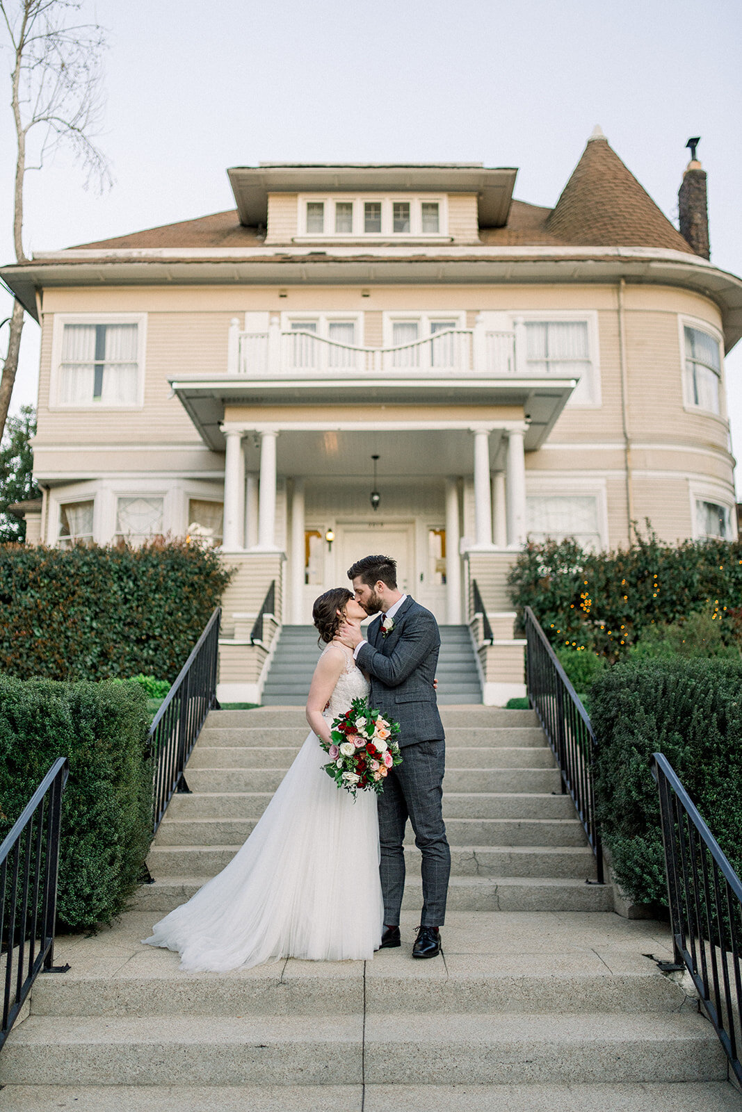 Bride and groom kiss after wedding at Vizcaya in Sacramento, CA
