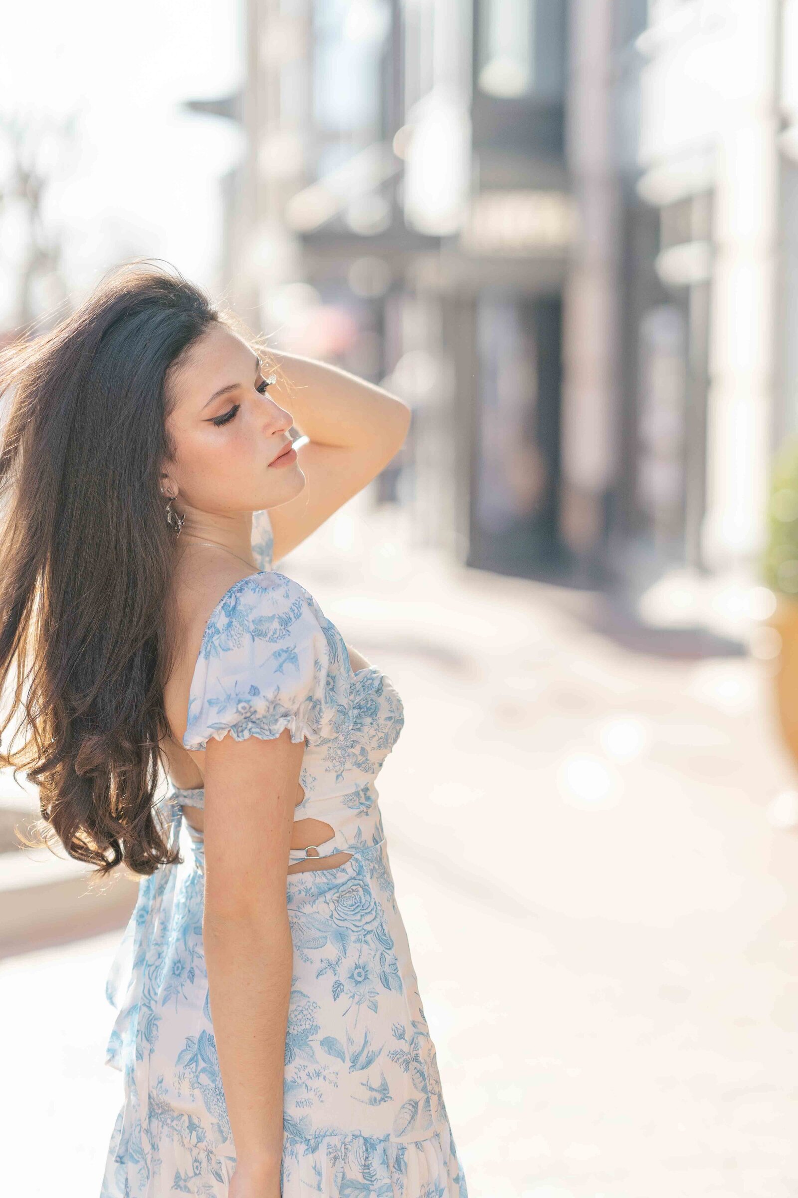 high school girl looking down during Reston, Virginia senior photo
