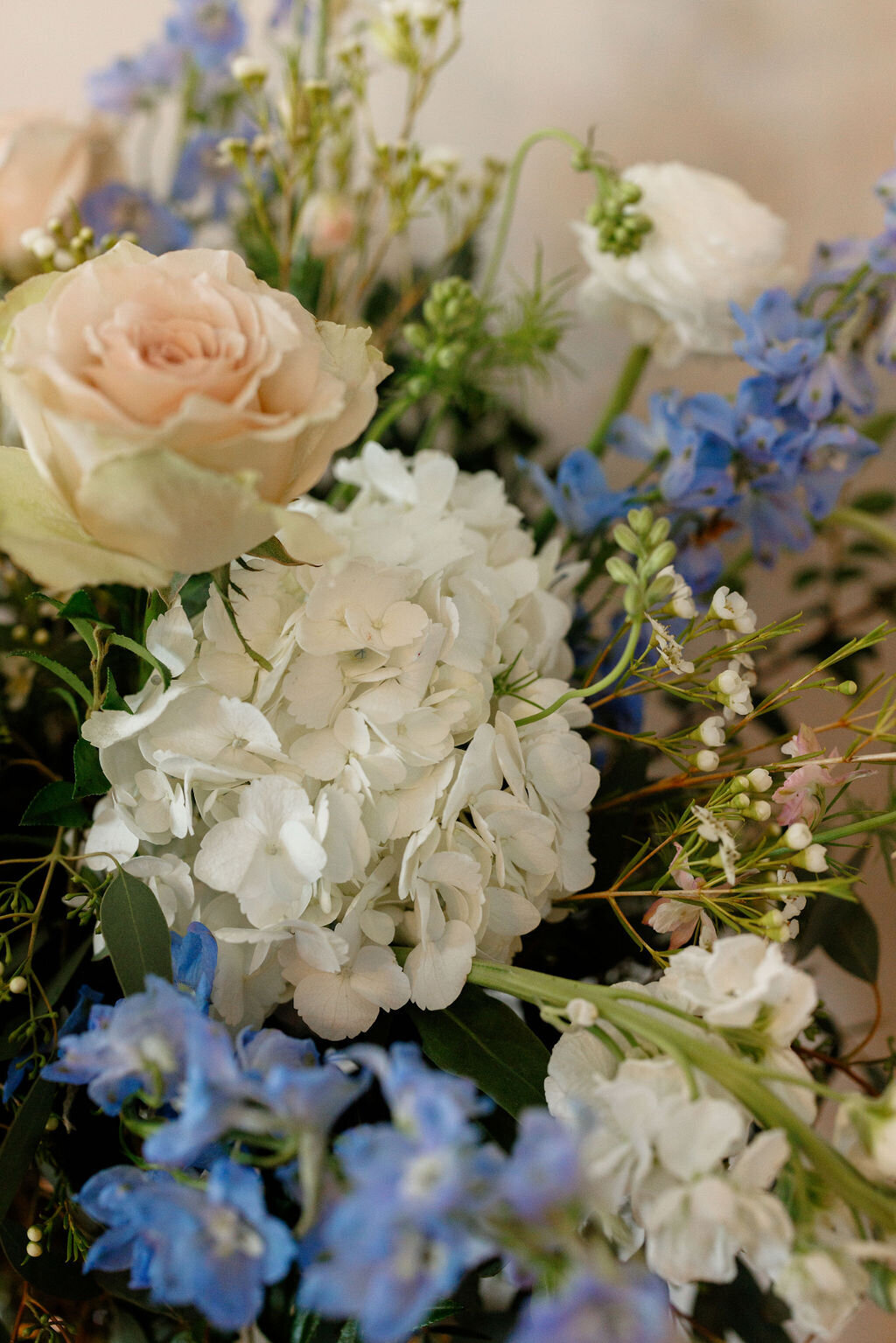 detail shot of peach, green, white, and blue flowers — Madison Abernathy Photo