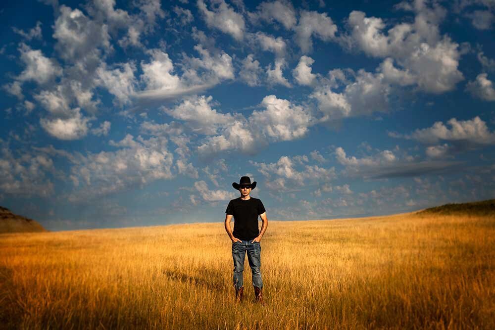 big-blue-sky-country-golden-wheat-field-cowboy-black-hat-cinematic-amazing