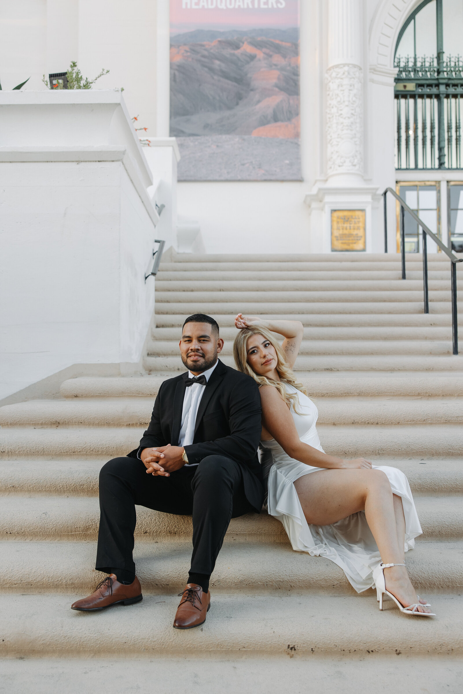 latino wedding, latino engagement session, balboa park session, couple sitting down, formal attire engagement session