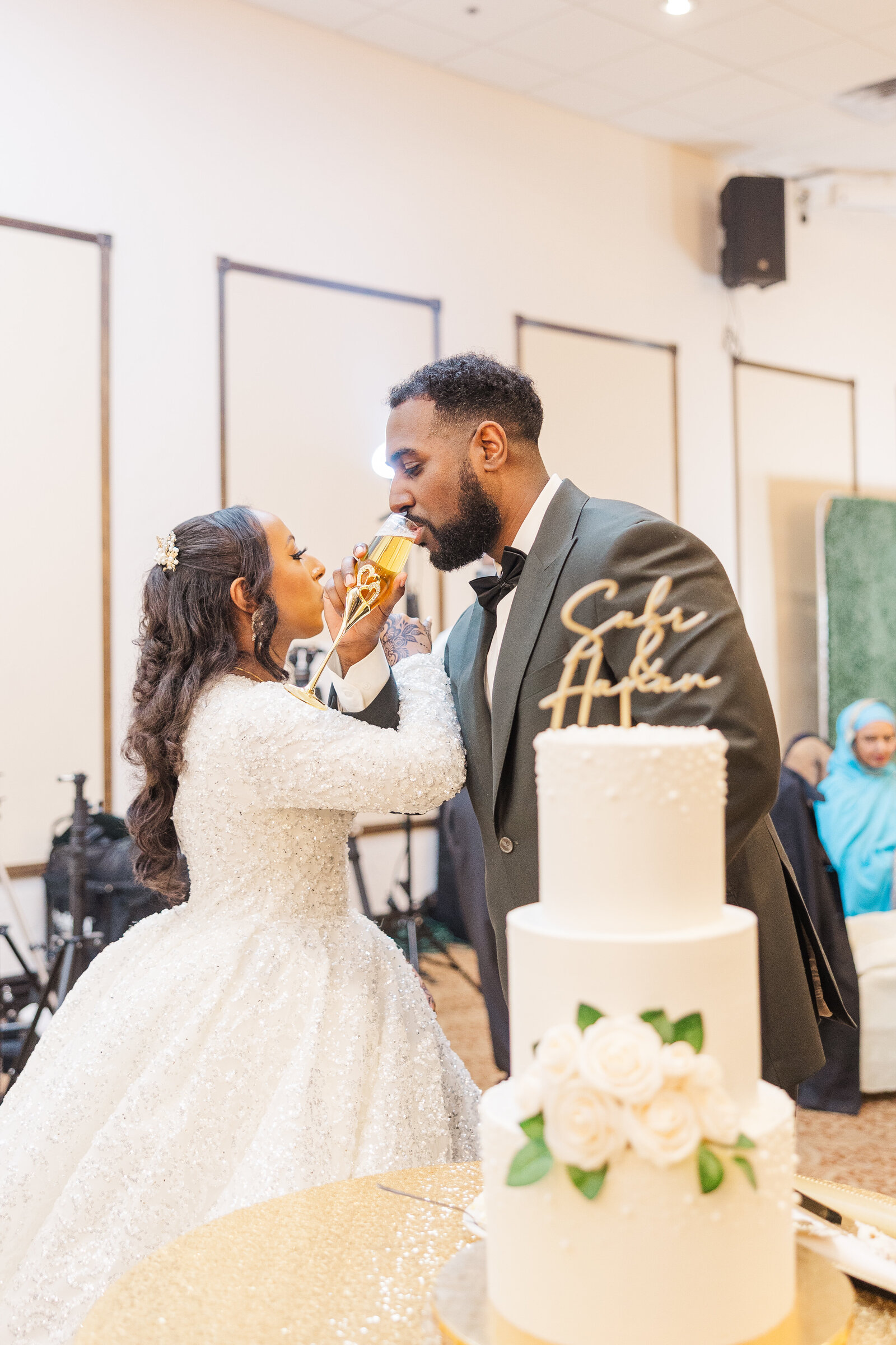 Bride and groom wedding cake cutting ceremony