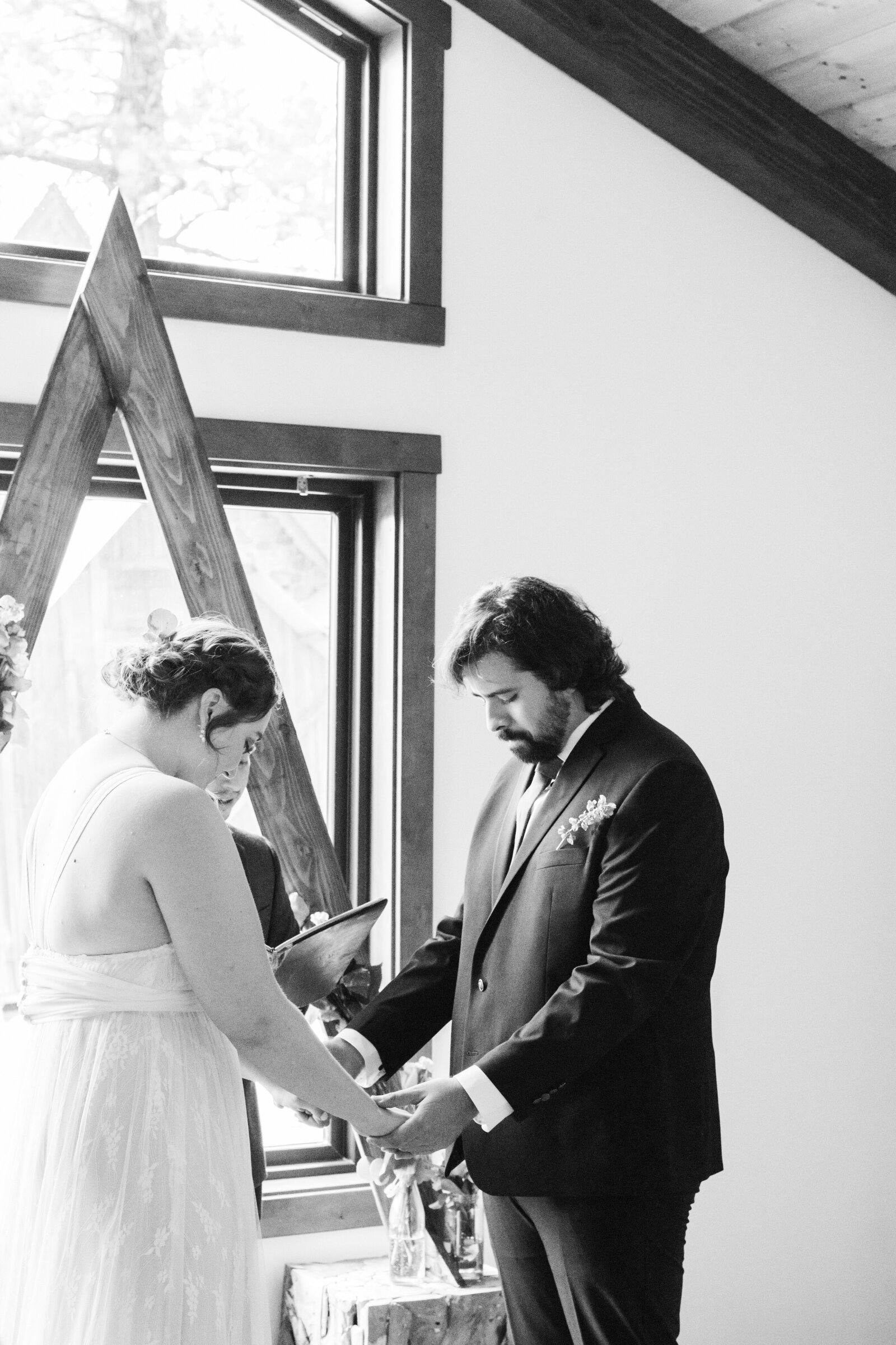 A couple celebrates their intimate elopement at a cabin at Big Bear Lake, California.