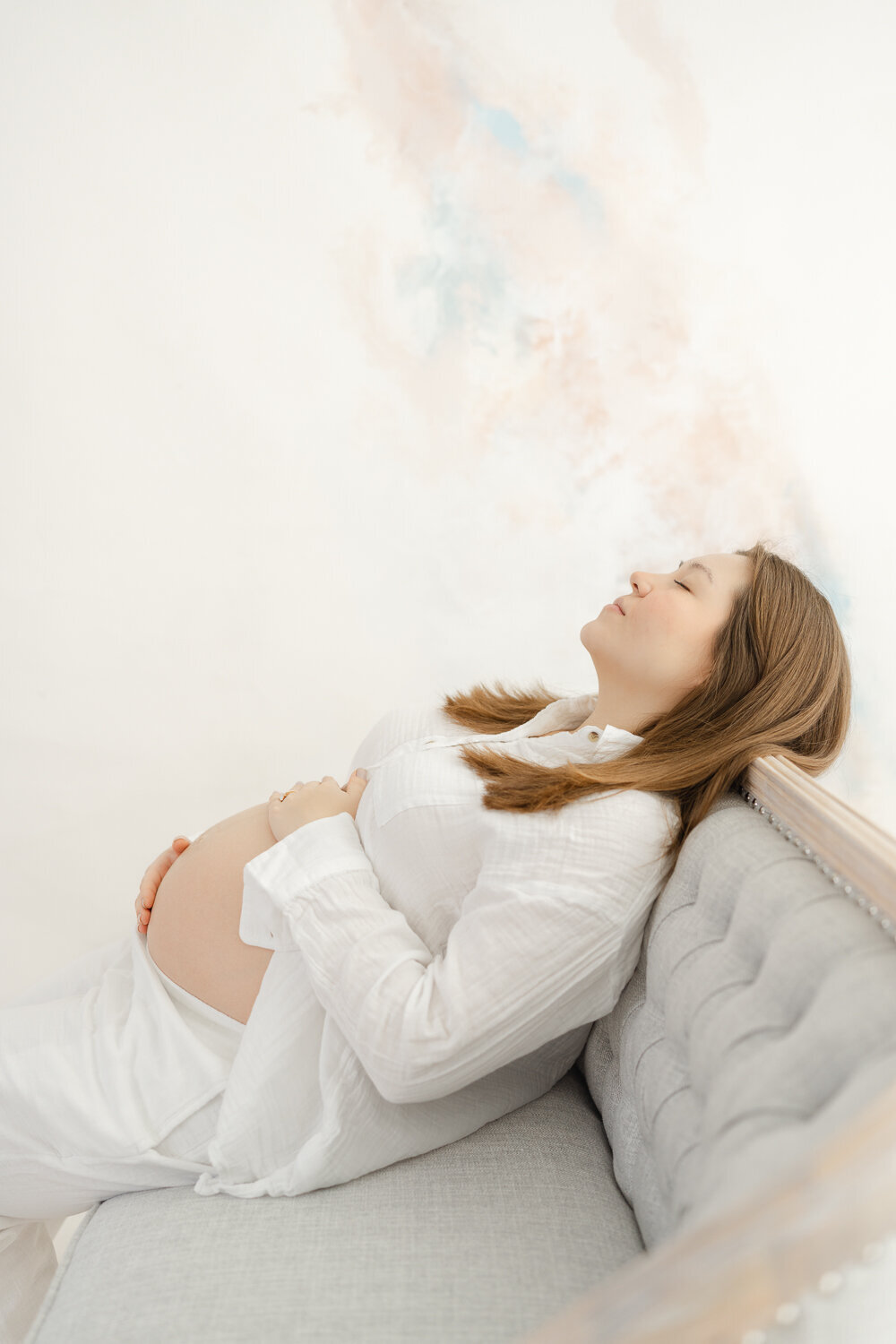 mom relaxing during studio maternity picture