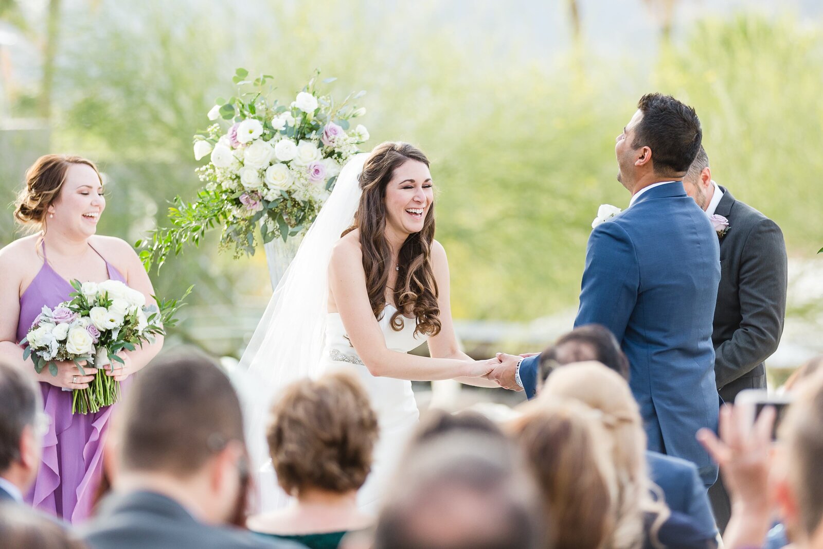Bride and groom laughing during their ceremony at the Sanctuary on Camelback Mountain.