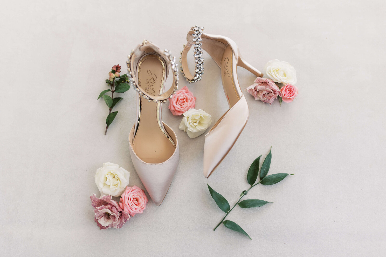 Bridal shoes styled with extra florals from the bride's florist.