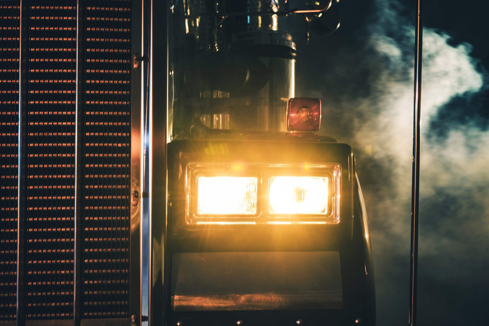 transport-truck-headlights-closeup-nighttime