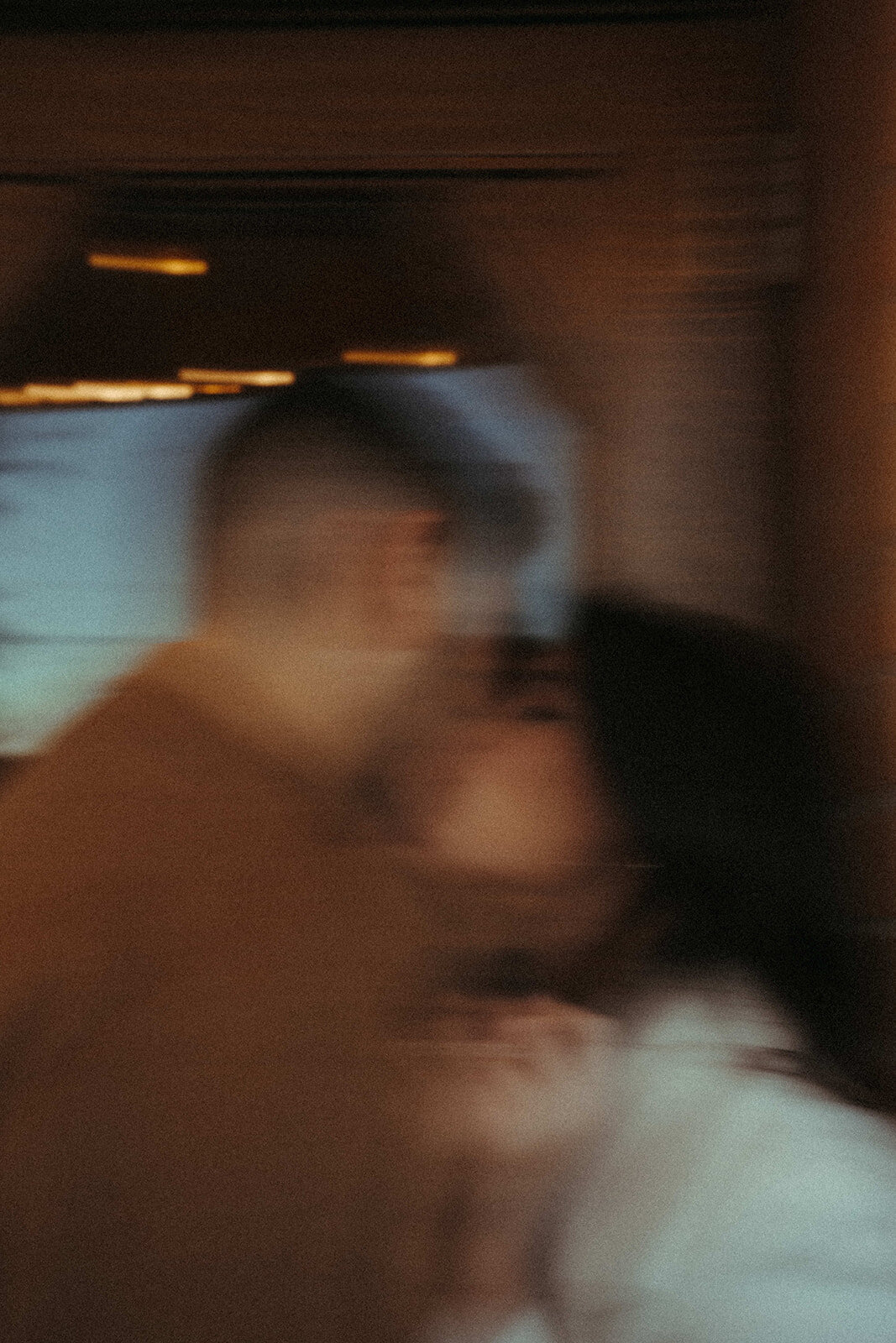 blurry photo of couple kissing