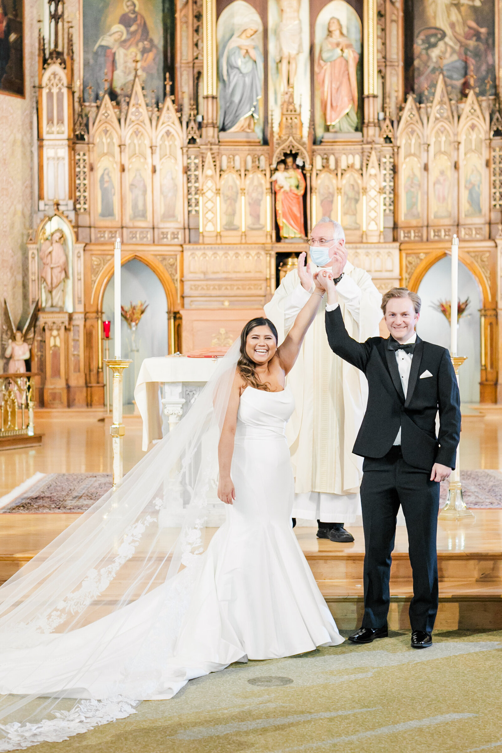 27_bride_and_groom_after_ceremony_at_alter_in_Catholic_church_chicago_illinois