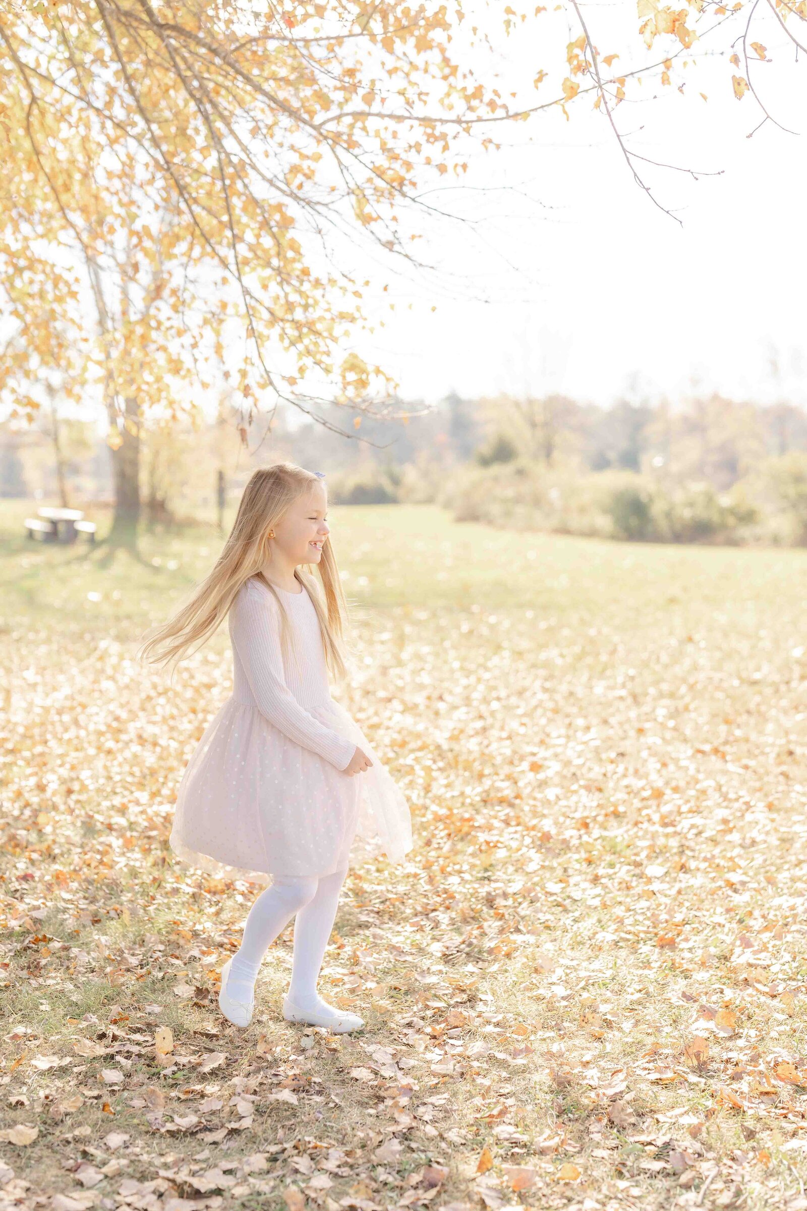 girl laughing during fall minis in Haymarket,VA