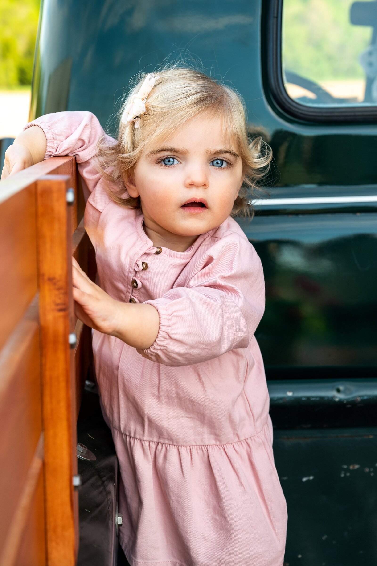 Toddler in back of truck