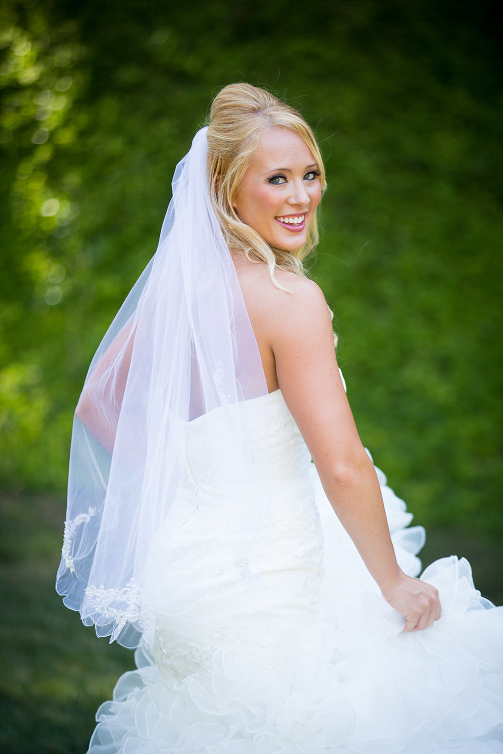 bride twirling and smiles