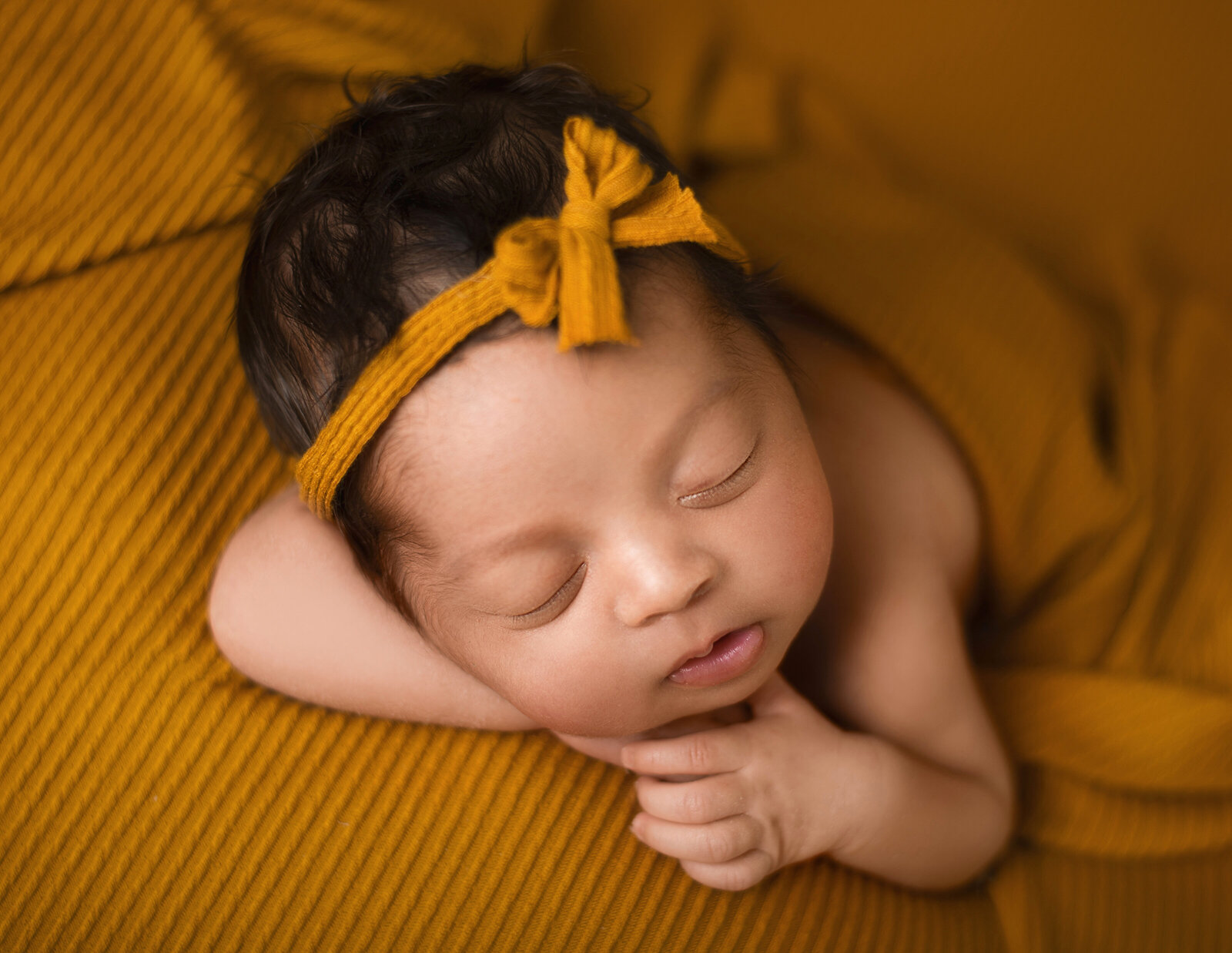 cute mustard baby photo chin on hands