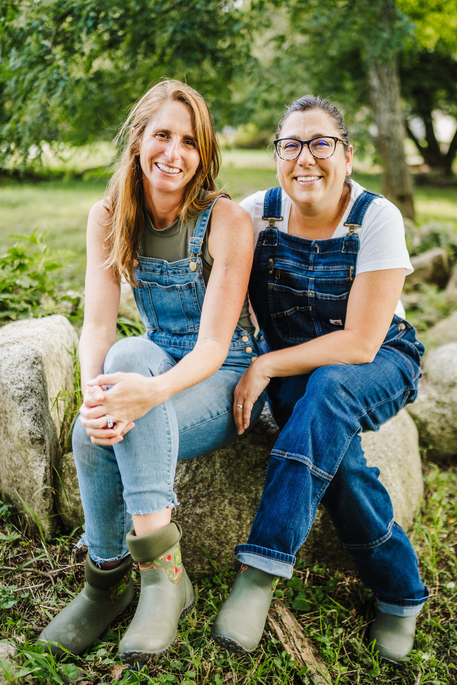 gardeners sit on a rock together