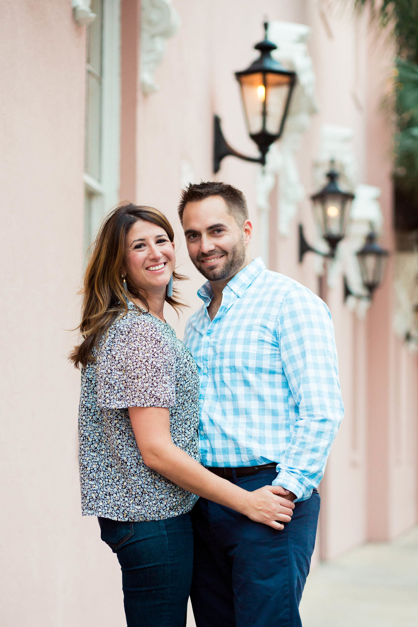 Engaged couple walks down a cobblestone road in the French Quarter, Downtown Charleston, South Carolina