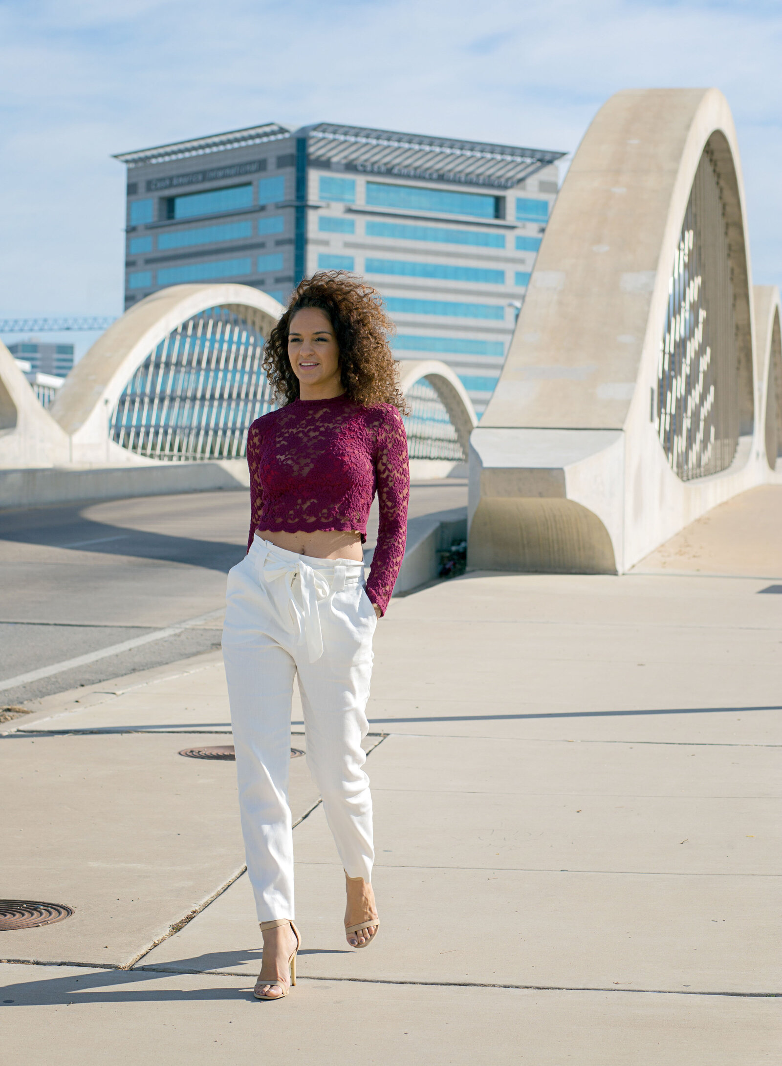 woman walking by bridge