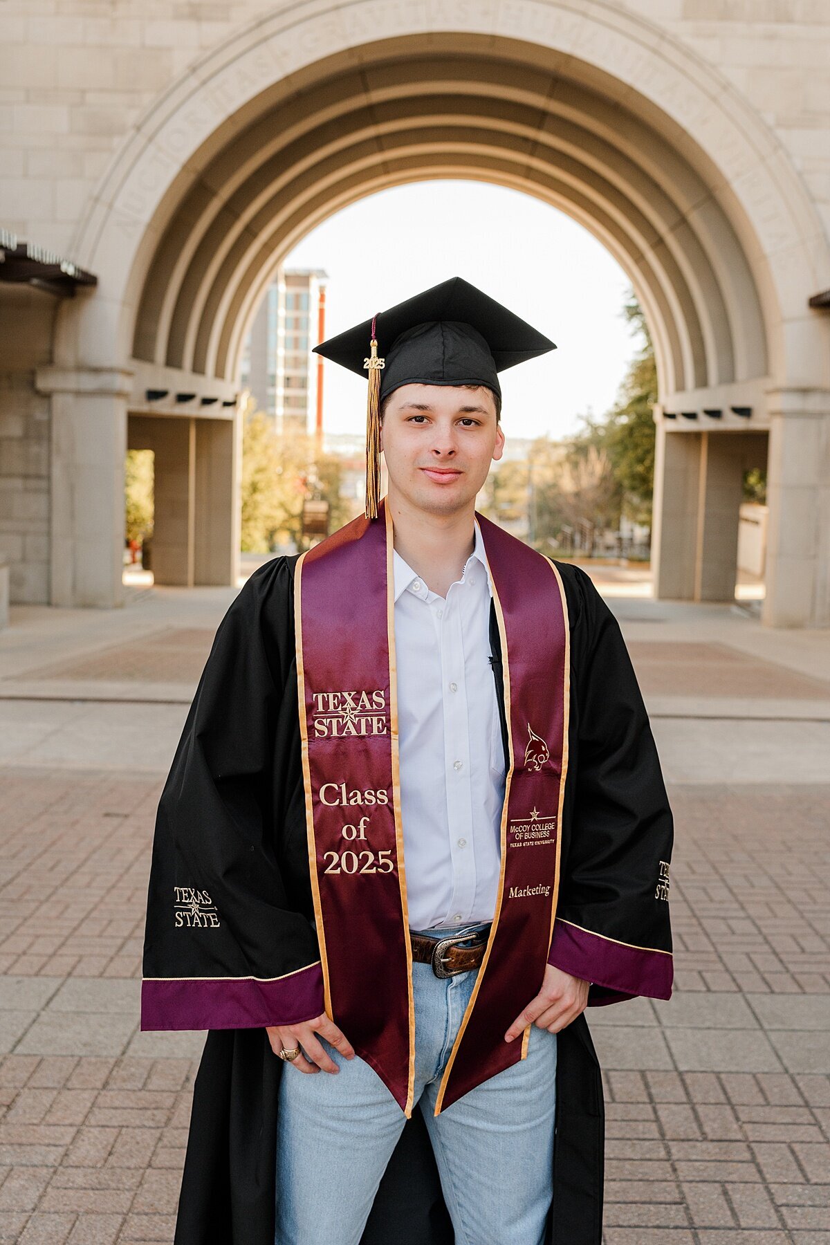 Texas state grad guy by the arch 