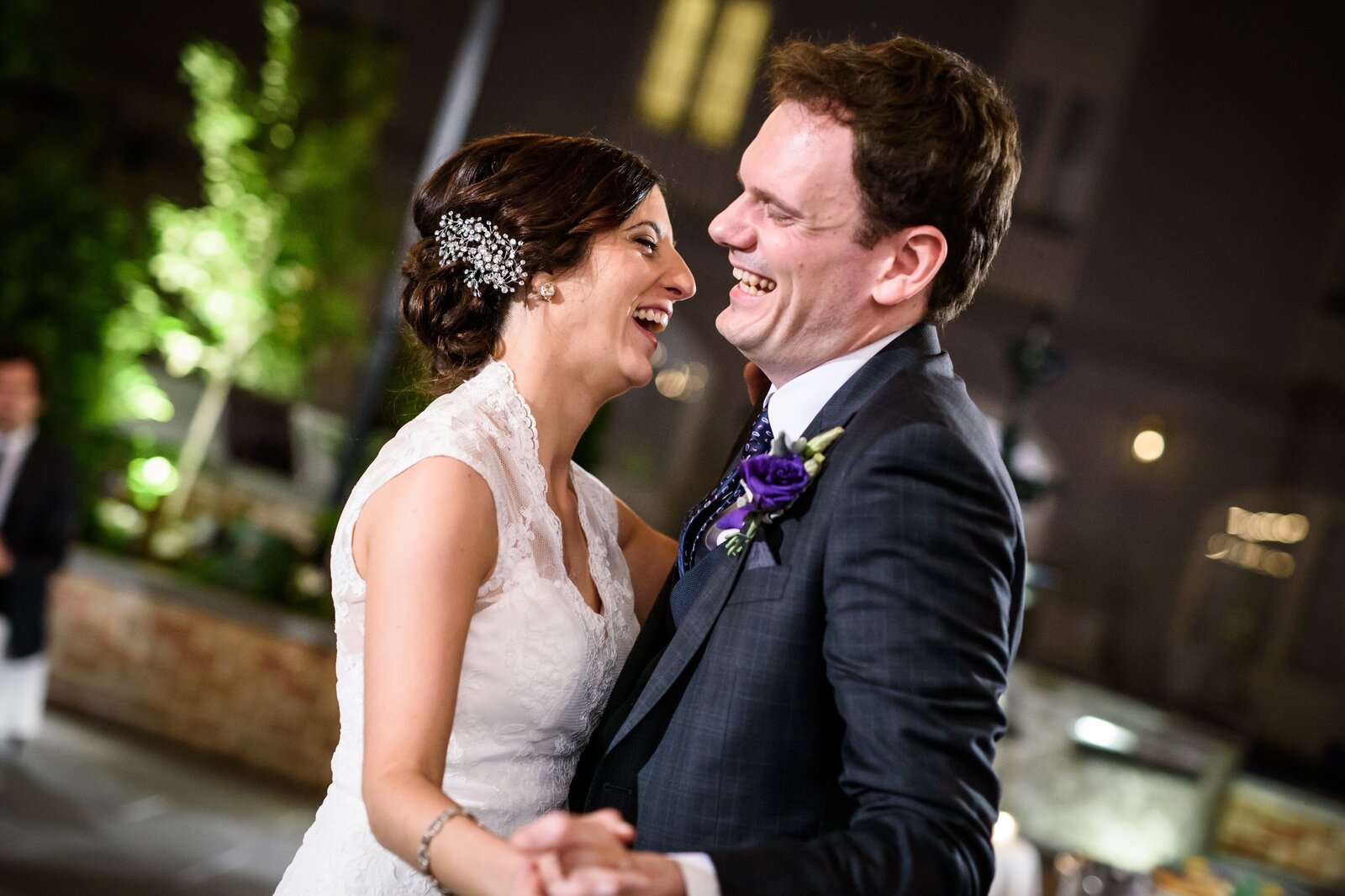 Bride and groom laugh during first dance at Maison Dupuy wedding