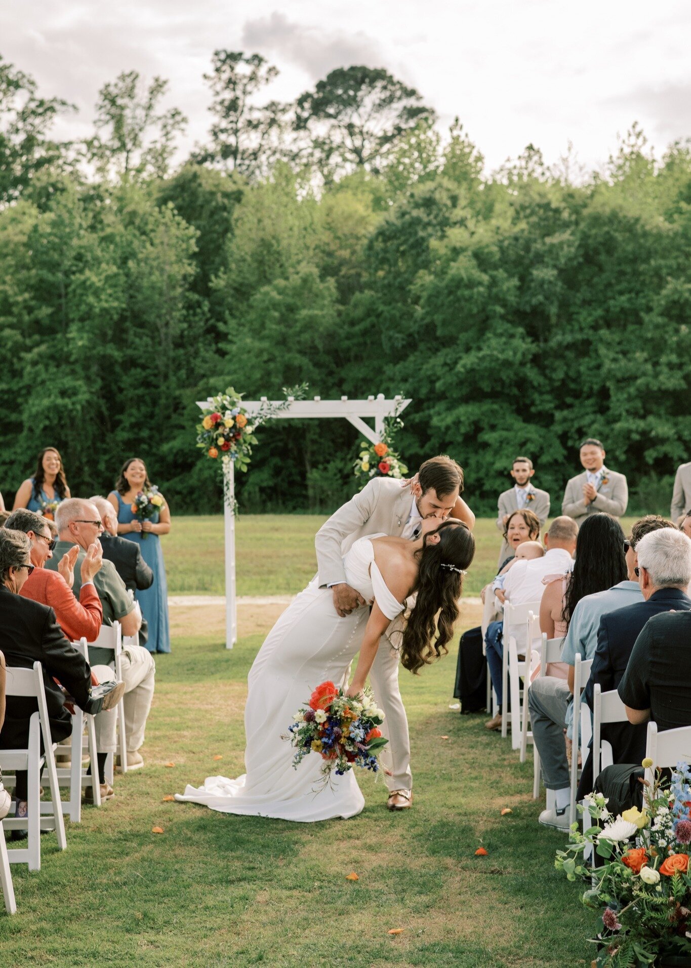 Island-Ceremony-Couple-Kissing-The-Legacy-at-Willow-Pond.JPG