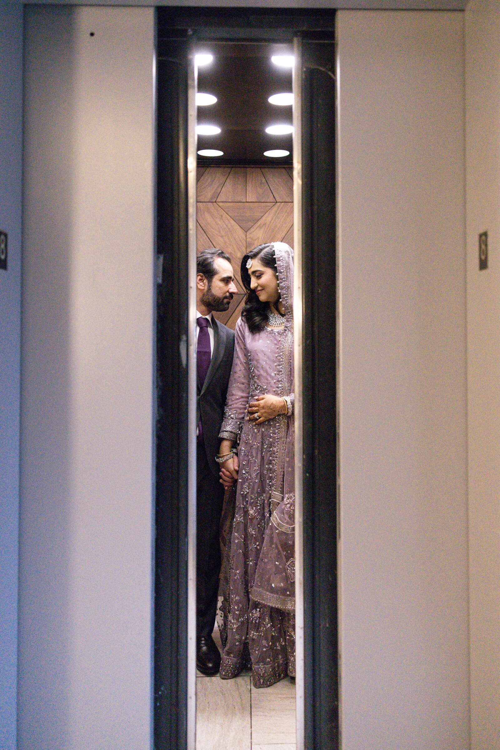 Bride-and-groom-in-elevator-portrait