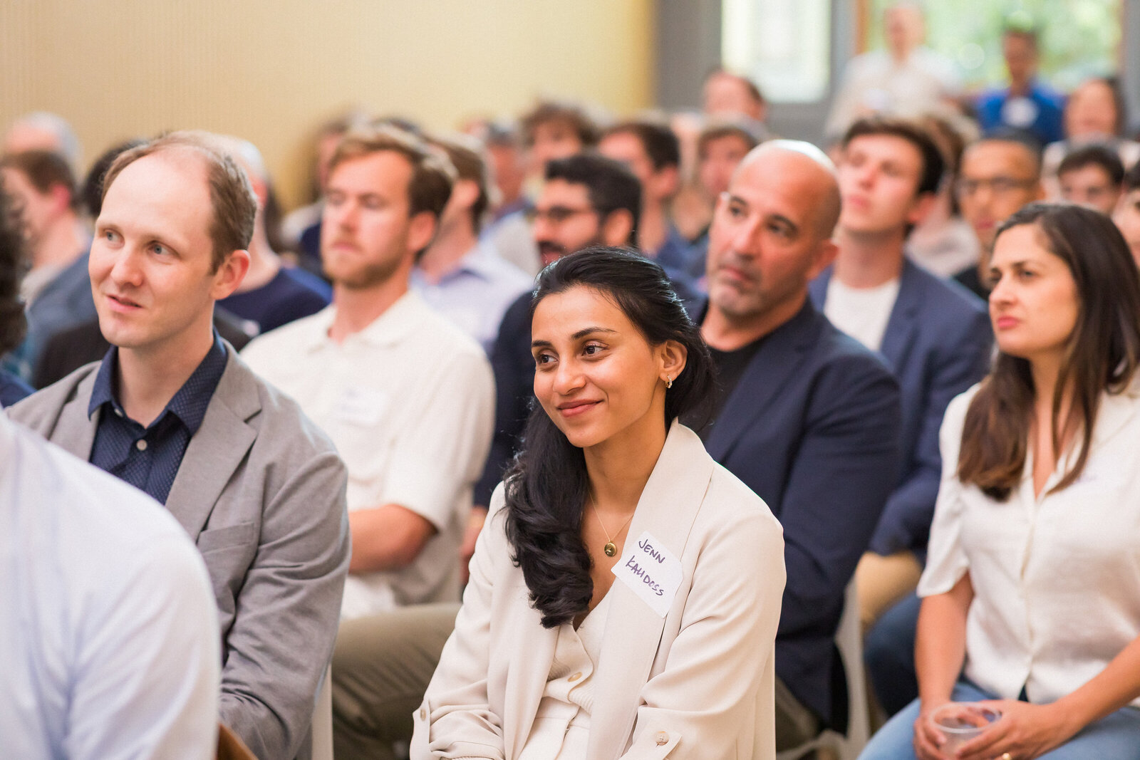 Wide shot of the Holy Shift event with guests listening to the keynote.