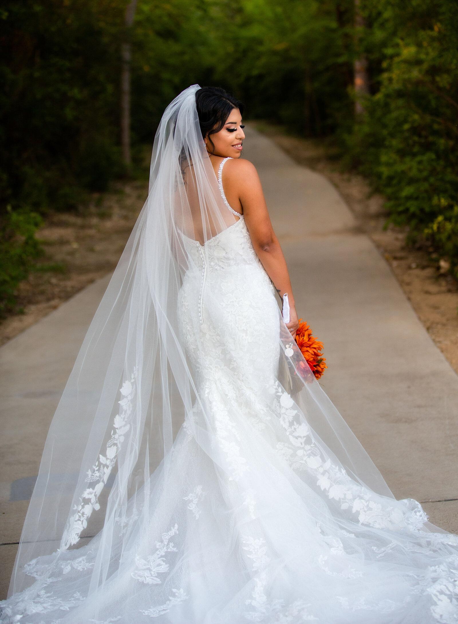 details in bride's train and veil