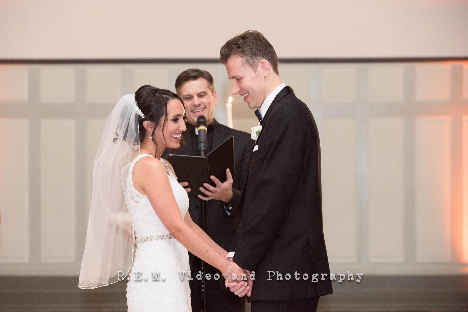 Bride and groom smile during wedding ceremony