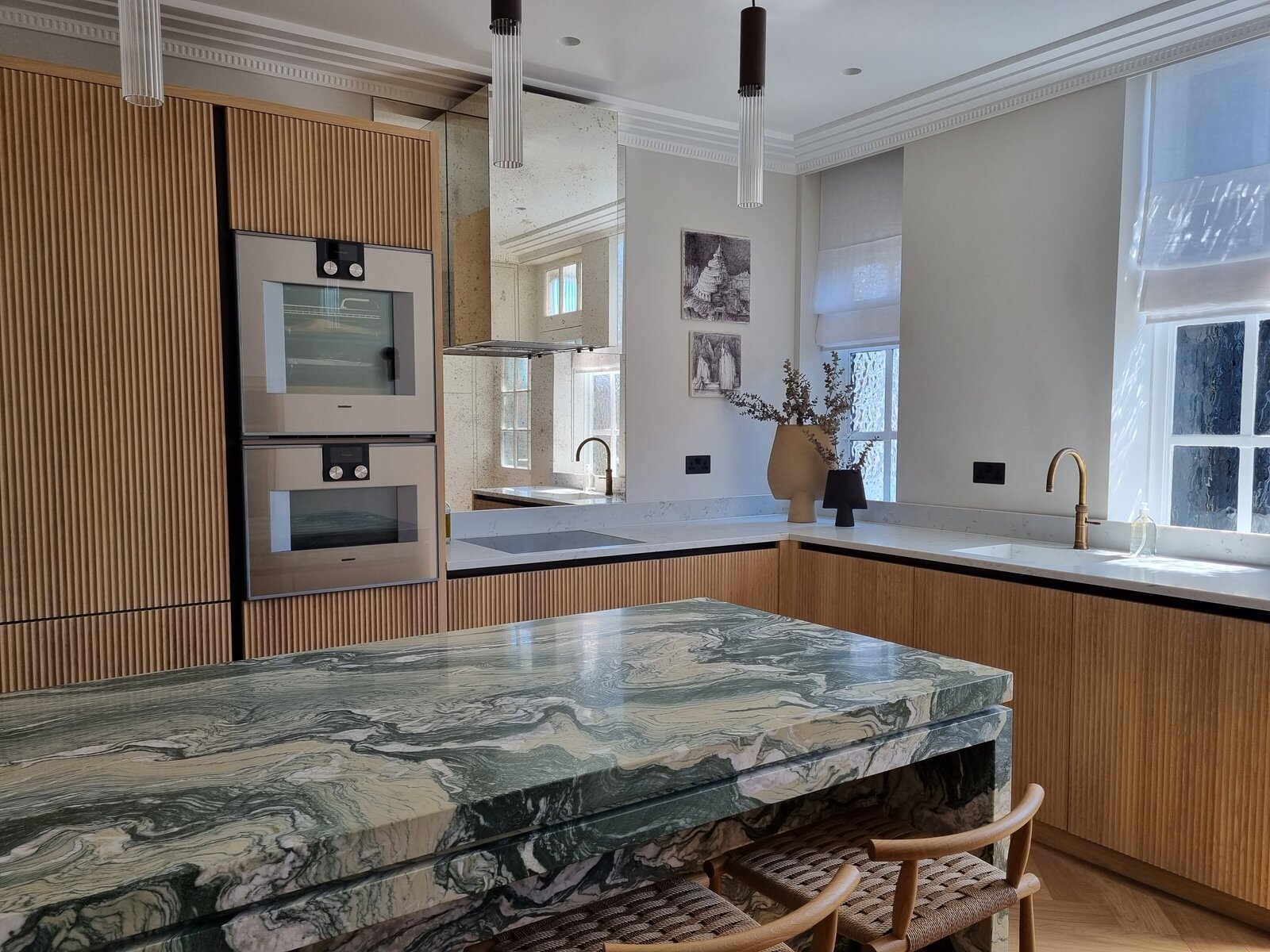 Marble island kitchen with fluted kitchen