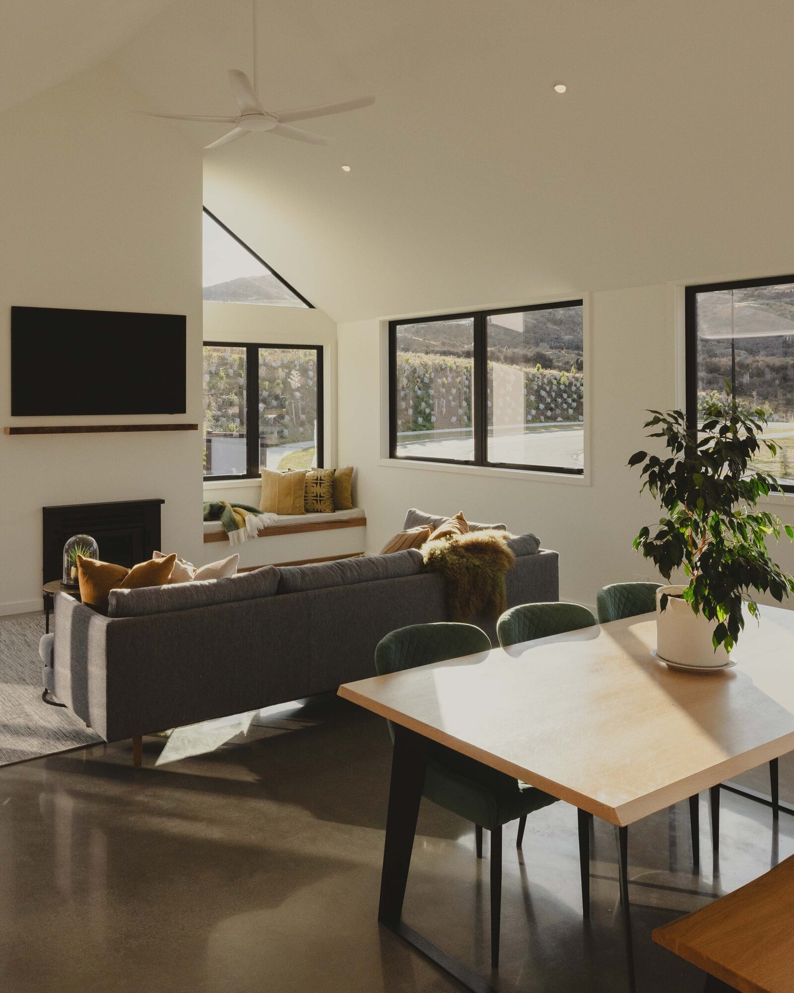 A light and bright living space with pitched ceilings in a home built by Twin Peaks Construction Queenstown.