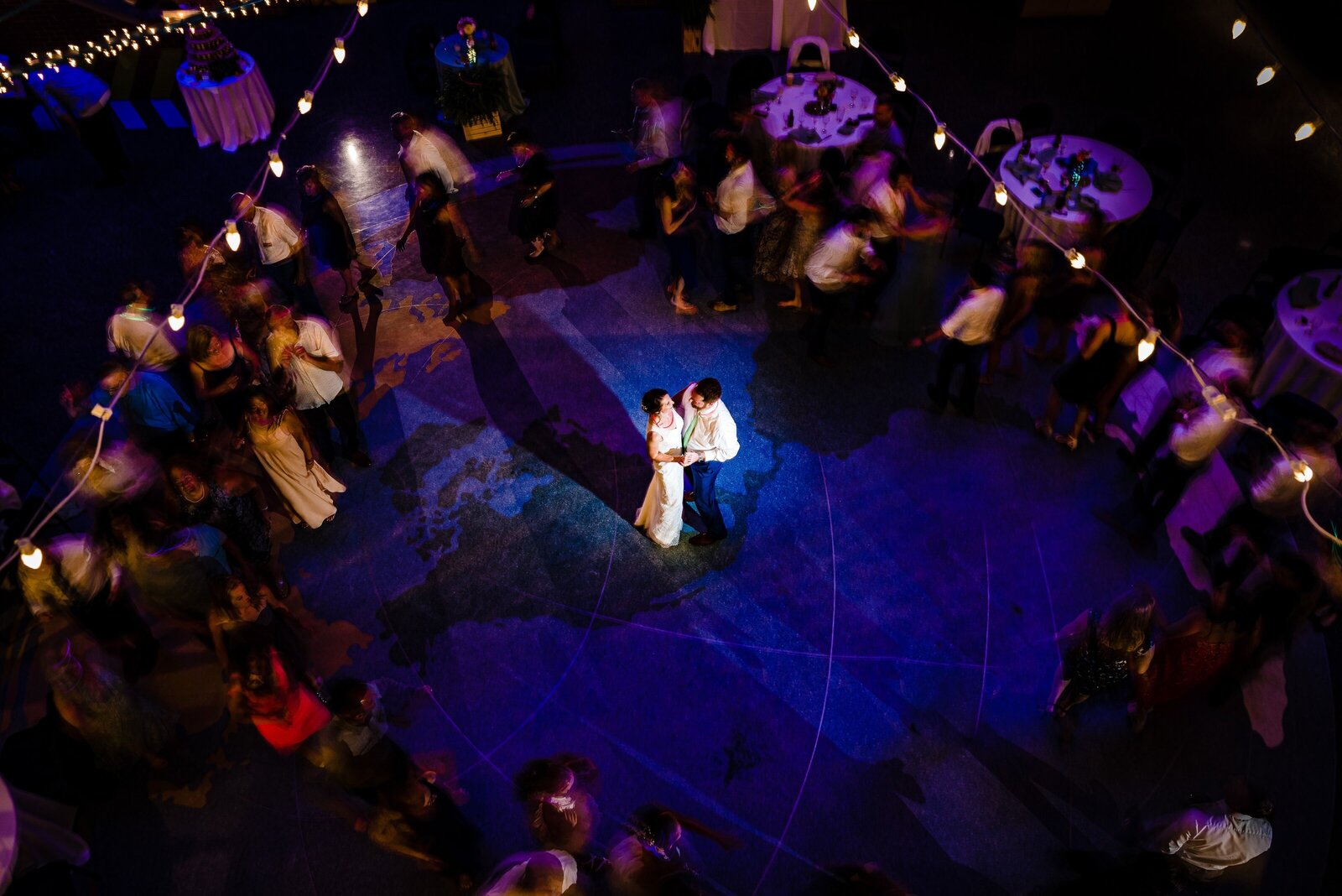 photo of a couple's first dance at their wedding taken from a catwalk above the dance floor