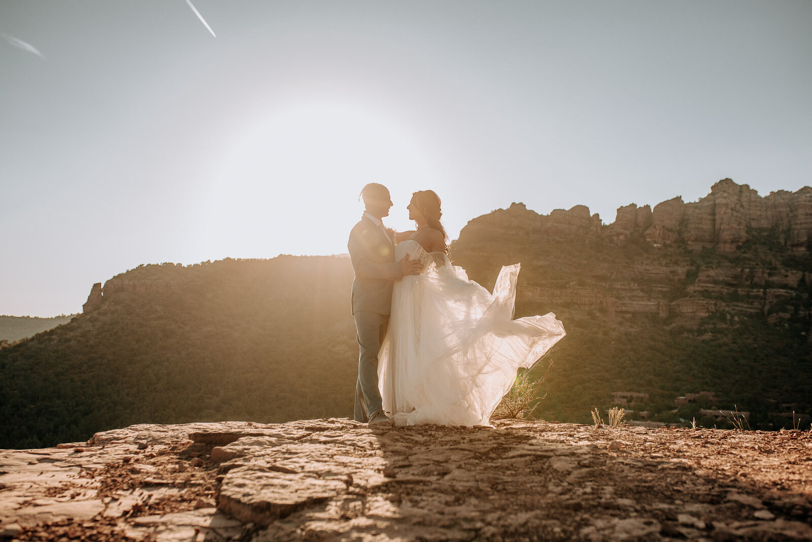 Romantic boho wedding dress in sedona red rocks for an adventurous arizona wedding