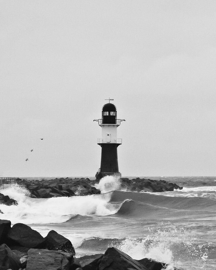 _Lighthouse At Storm With Waves Crashing, Black And White_ by Stocksy Contributor _Melanie Kintz_