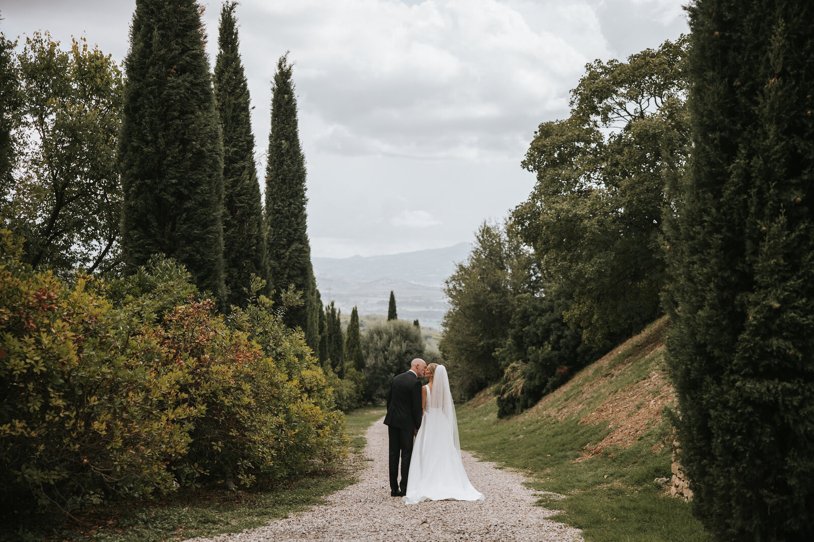 Couple celebrating their wedding day at Castello di Vicarello, surrounded by Tuscany’s beauty and history.