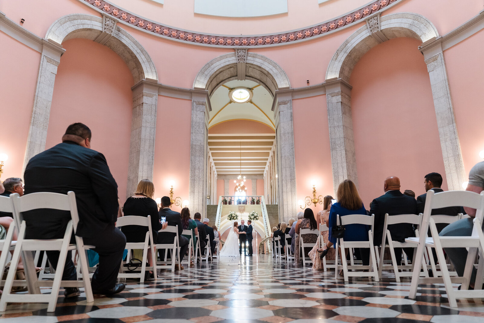 Wide angle photo of a wedding ceremony in the Rotunda of the Ohio Statehouse